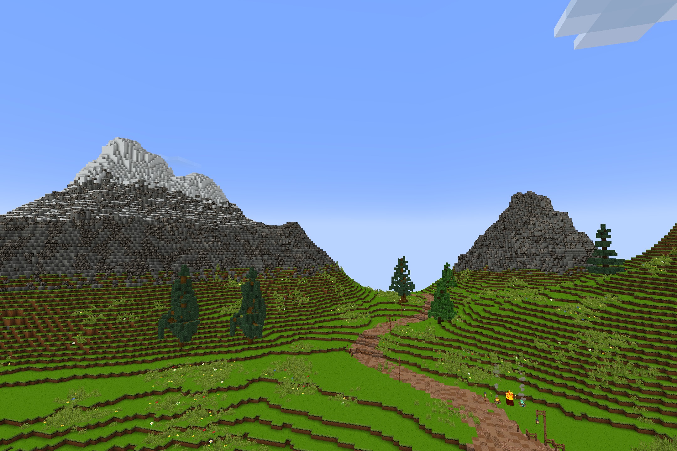 CartoonCraft Resource Pack Screenshot 6 Lush green hills and a dirt path leading to distant snow capped mountains