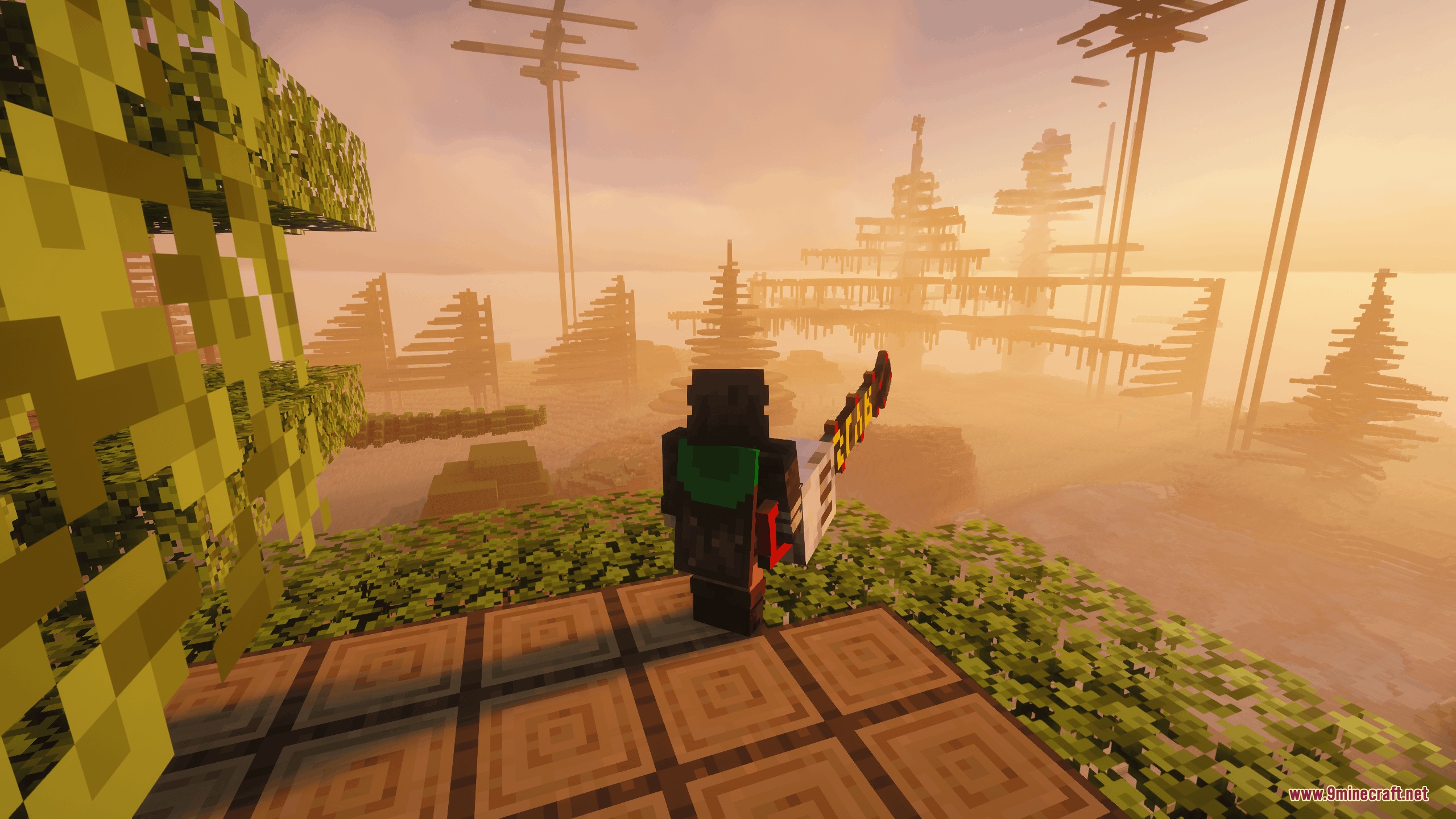 Chaos Persists Ore Spawn Remake Mod Screenshot 3 Minecraft player holding a chainsaw weapon overlooking a foggy sunset landscape