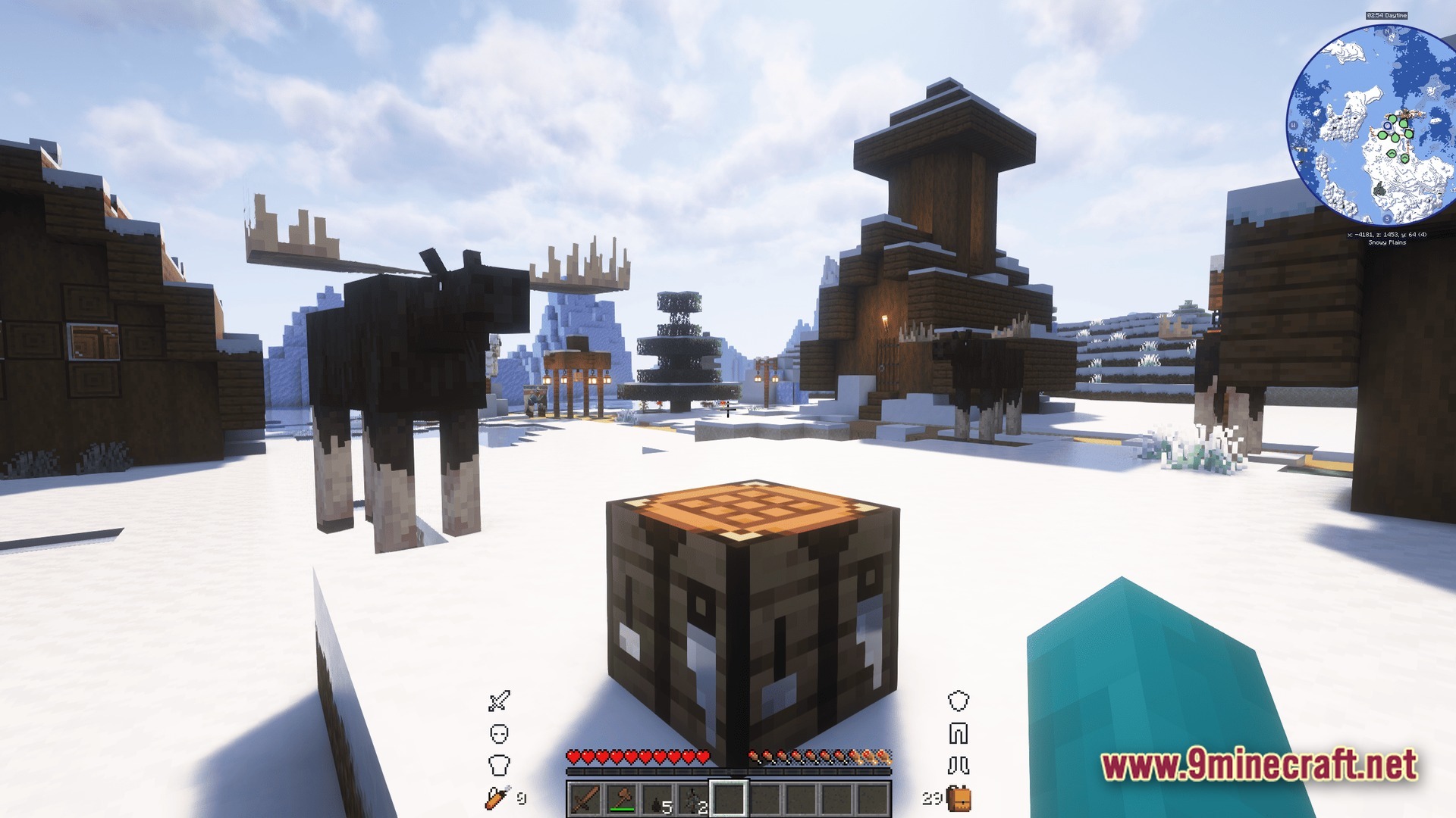 Moose stand near wooden structures in a snowy biome with a crafting table in the foreground
