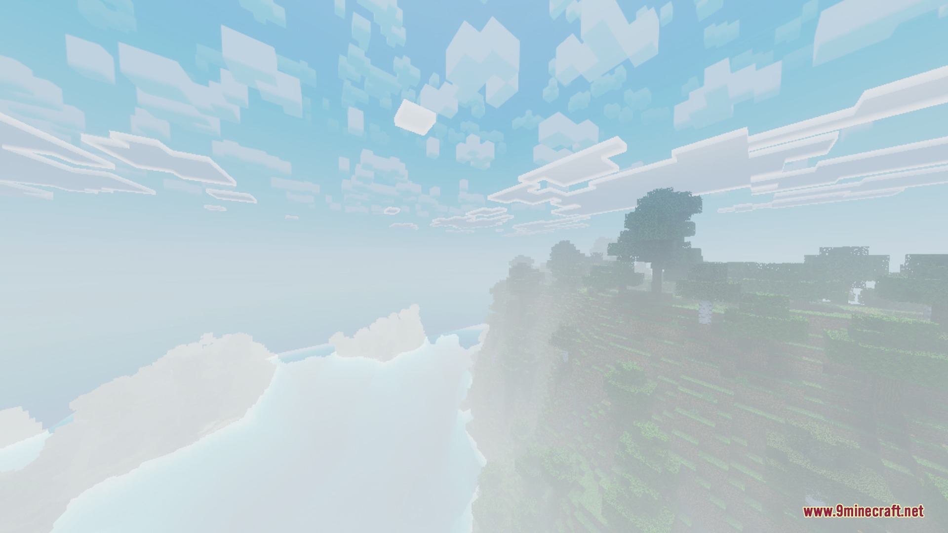 A misty cliffside view in Minecraft featuring realistic fog and blocky white clouds