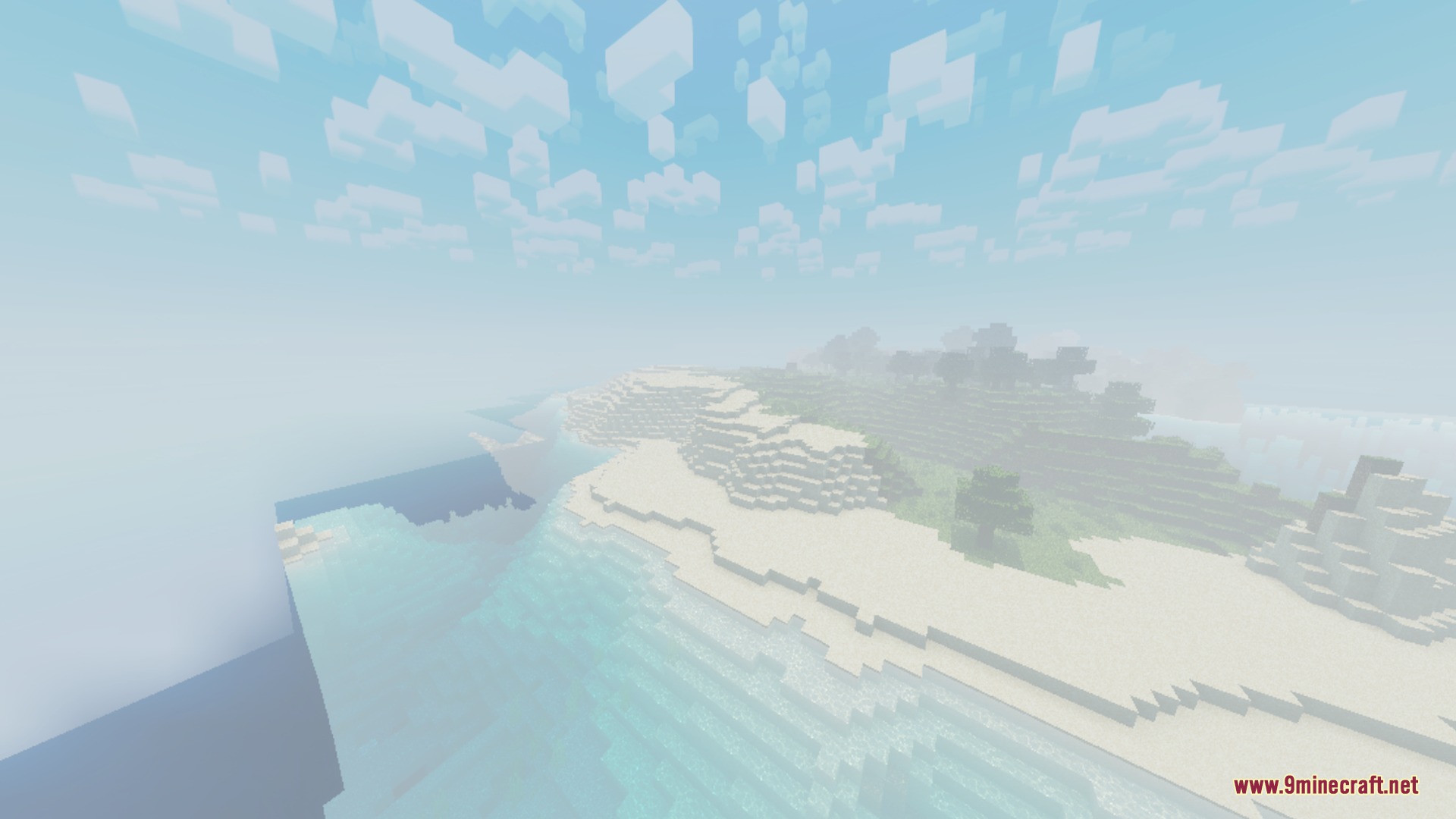 A scenic view of a foggy beach and ocean with soft lighting