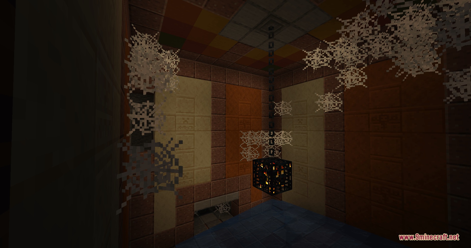 Cinch's Lost Mob Grinders Mod Screenshot 2 A broken mob spawner hanging from a chain in a ruined room