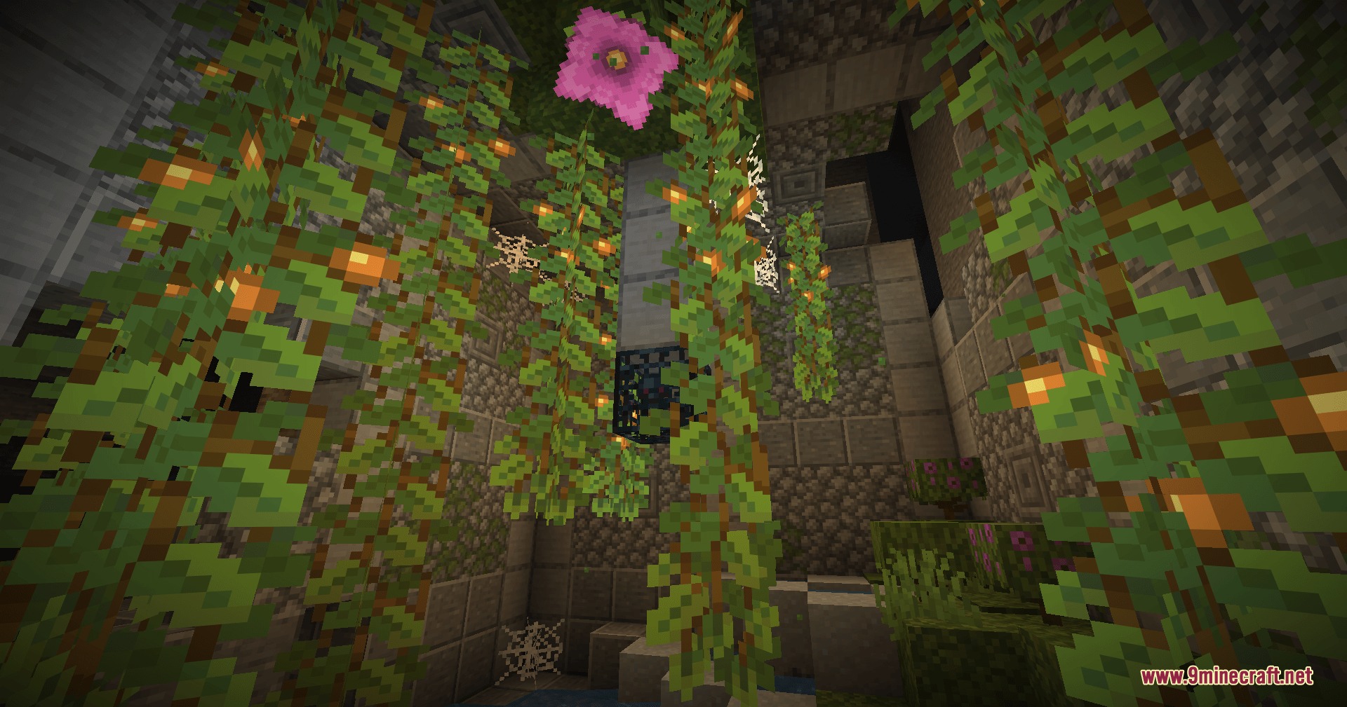 Cinch's Lost Mob Grinders Mod Screenshot 4 A mob spawner hanging in a lush cave room with vines