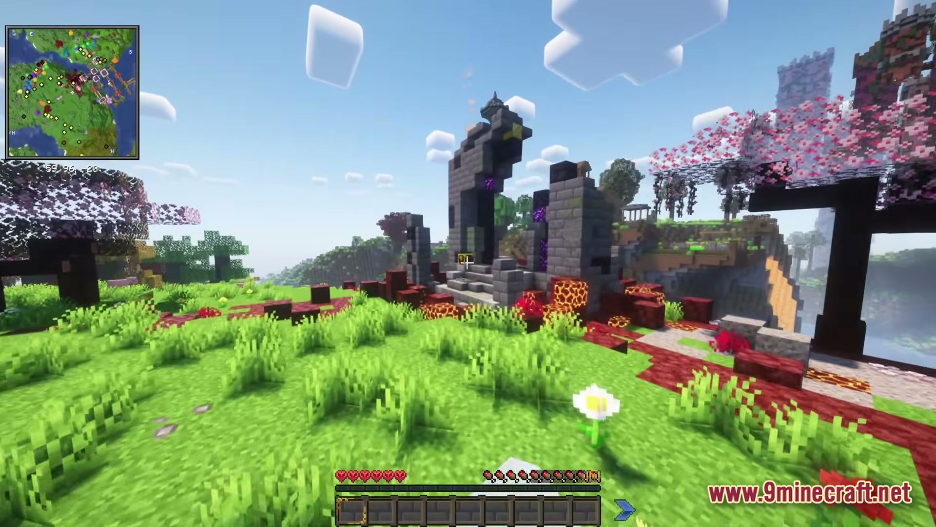Cisco's Fantasy Medieval RPG Modpack Screenshot 6 A ruined nether portal structure stands in a grassy biome near cherry blossom trees and mountains
