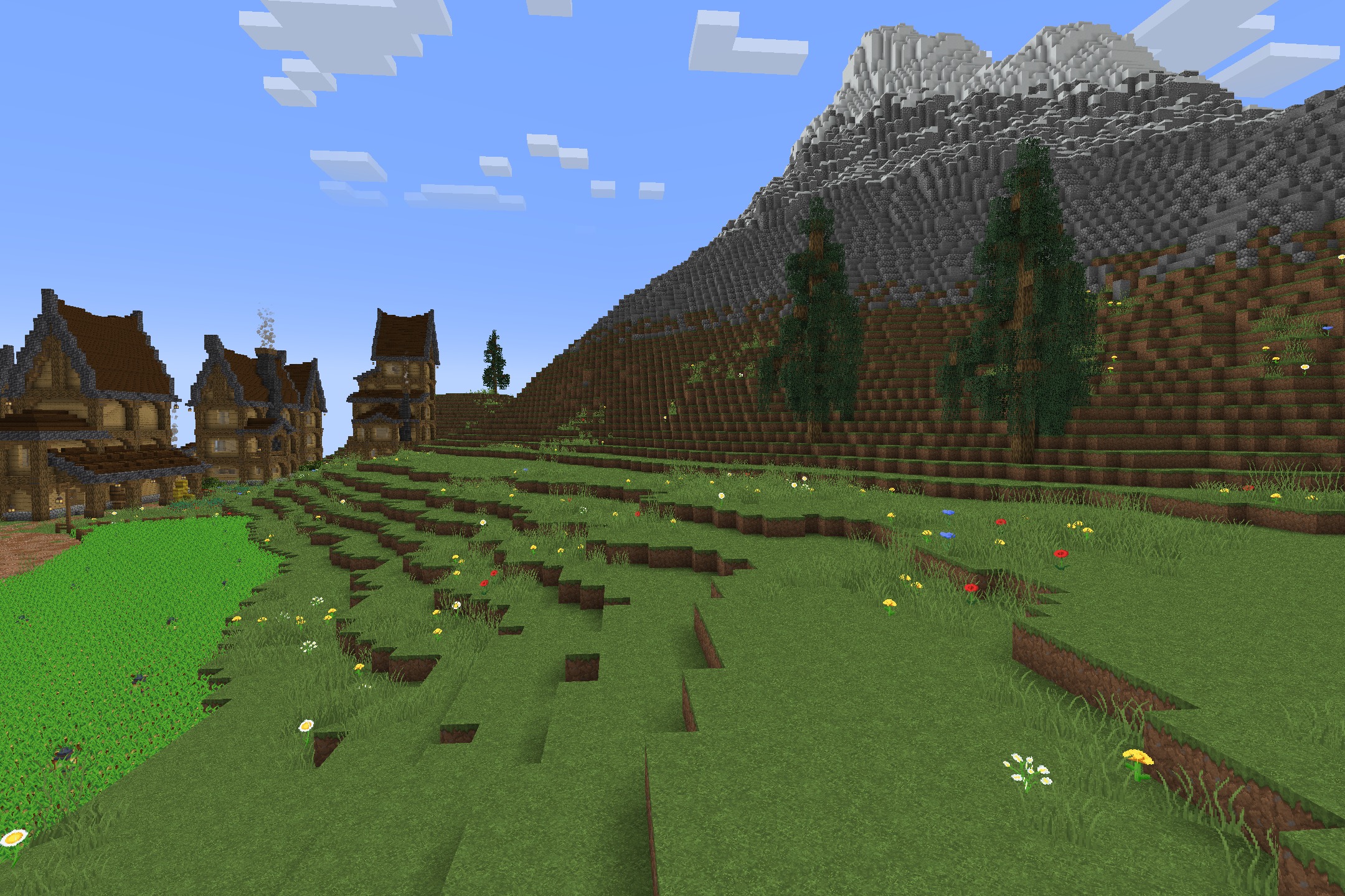 Classic Faithful 64x Jappa Resource Pack Screenshot 4 Scenic mountain landscape with detailed grass and houses using Classic Faithful style