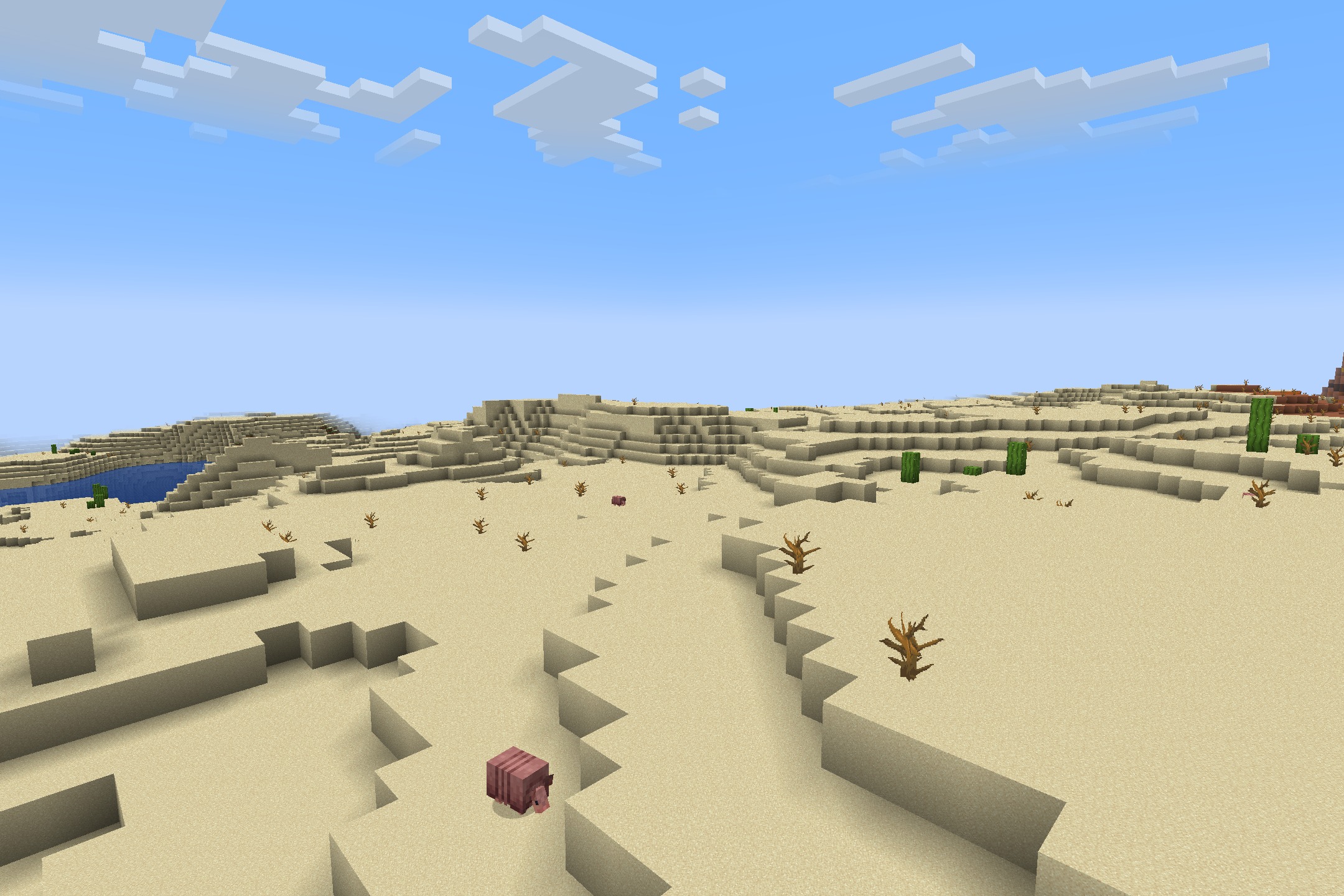 Classic Faithful 64x Jappa Resource Pack Screenshot 9 A pink armadillo wanders through a desert biome with high resolution sand blocks