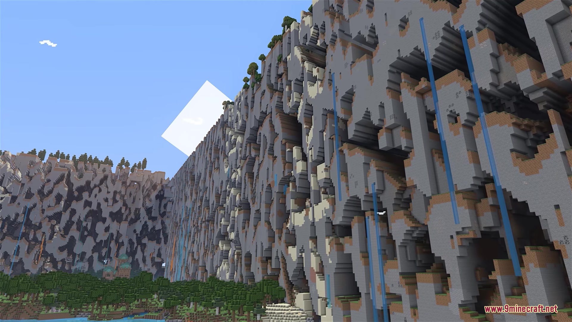 Classic Farlands Mod Screenshot 5 Massive walls of broken terrain blocks towering over a forest in Minecraft