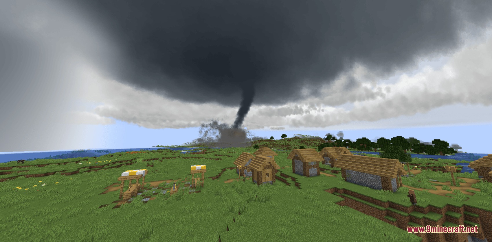 Climate Clouds Storms & Technology Mod Screenshot 1 A massive tornado touching down near a village under dark storm clouds