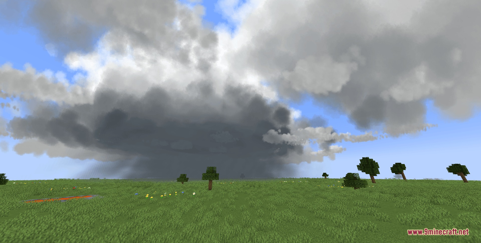 Climate Clouds Storms & Technology Mod Screenshot 8 Dark storm clouds gathering over a grassy field with wind blowing the trees