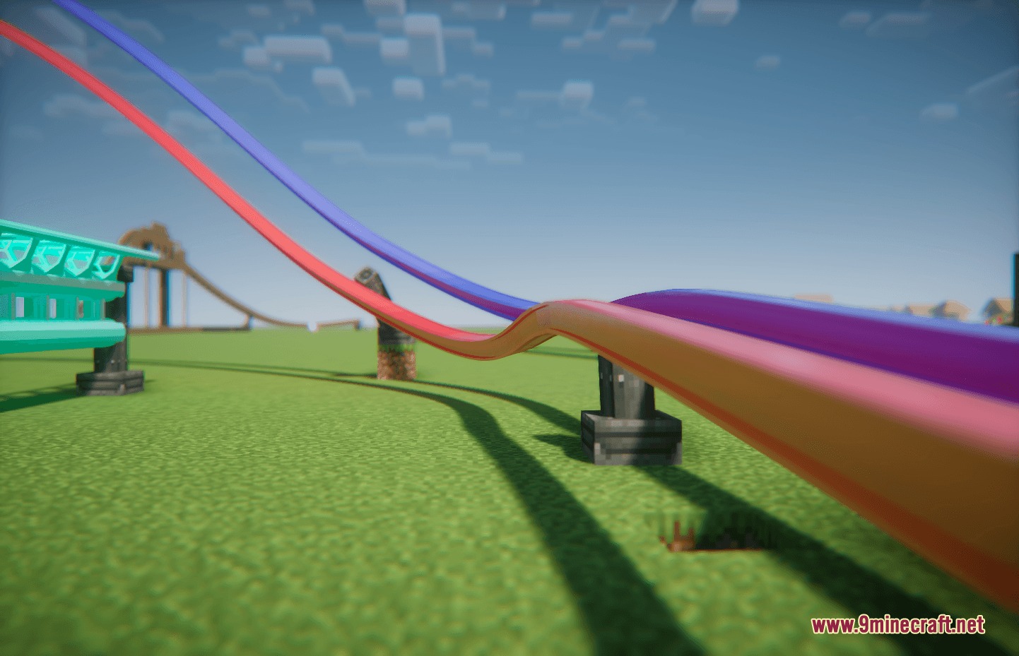 Coasters Simulated Track Styles Mod Screenshot 5 Smooth red and purple roller coaster tracks curving through a sunny Minecraft world
