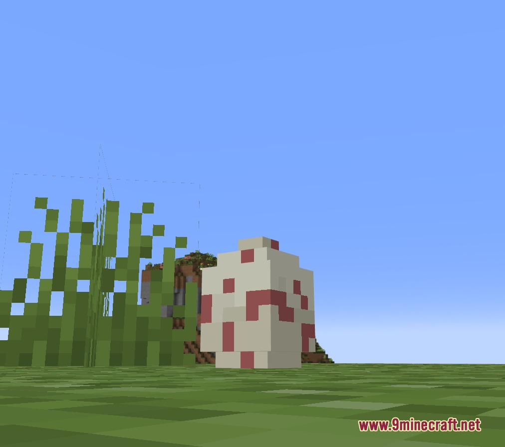 A white and red creature from the Cobble Digimon Mod stands in grass
