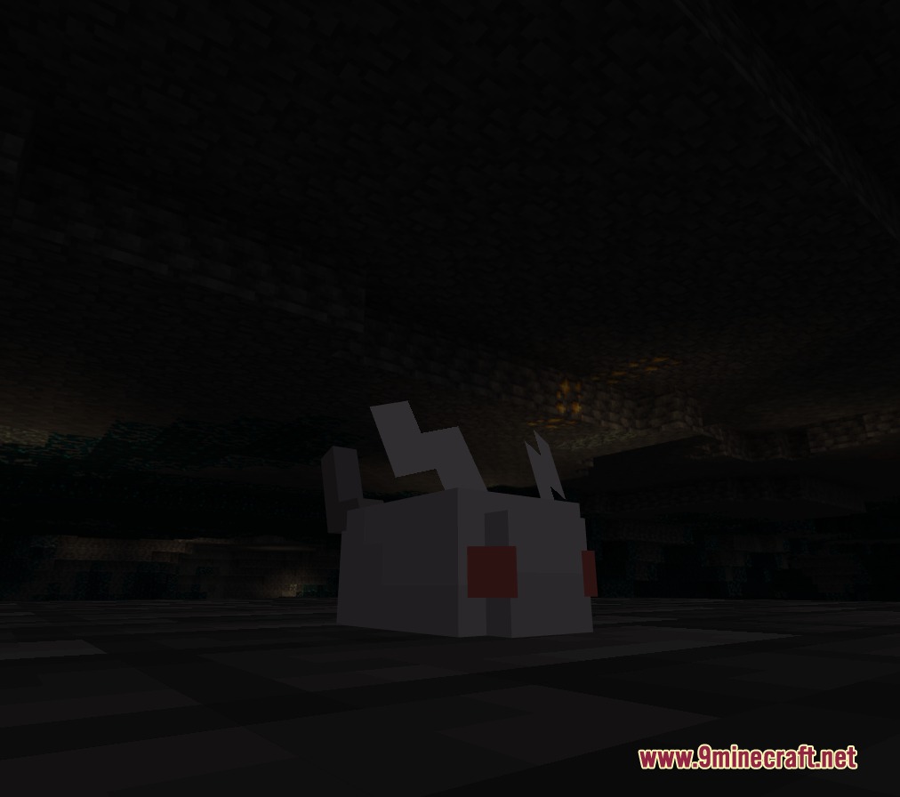 A small white creature with red eyes sits in a dark cave