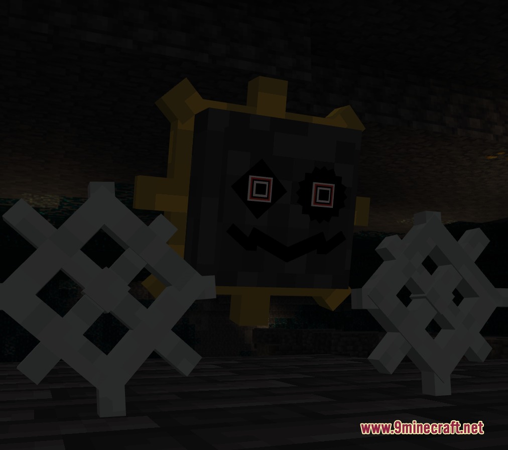 A grey gear shaped creature with red eyes in a dark cave