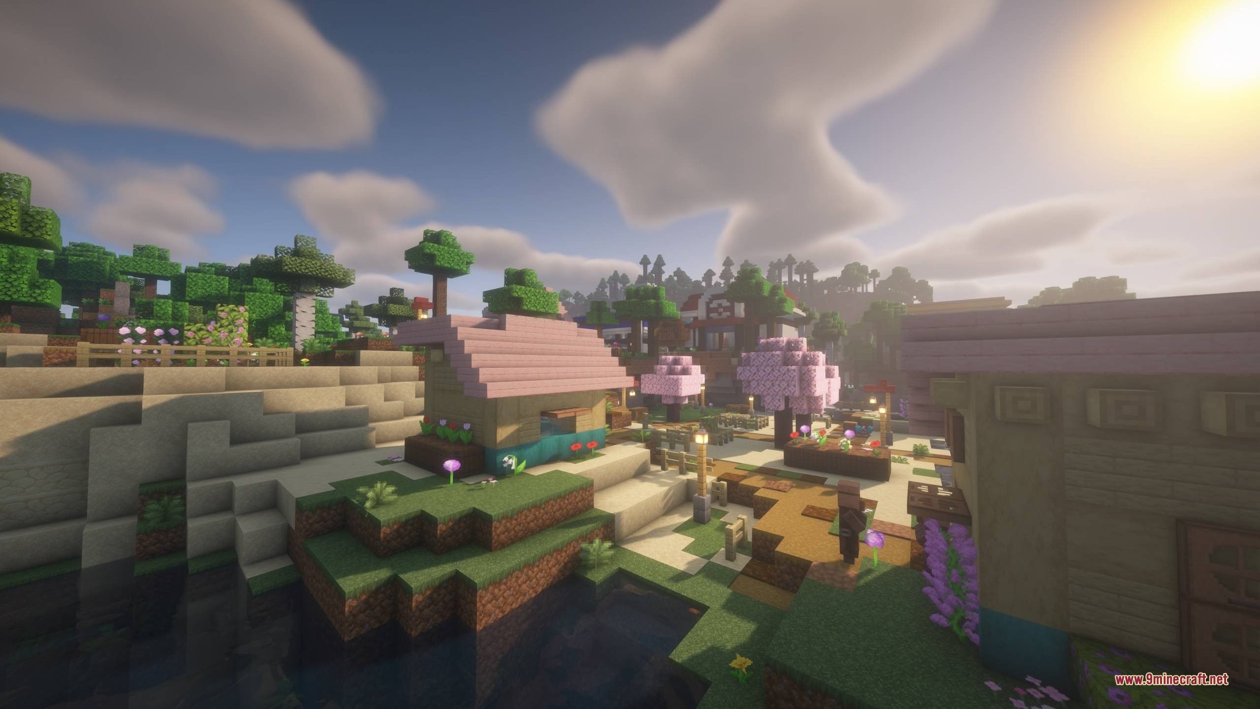 Cobble Towns Unofficial Update Data Pack Screenshot 3 A peaceful Minecraft village featuring pink roofed houses and cherry blossom trees