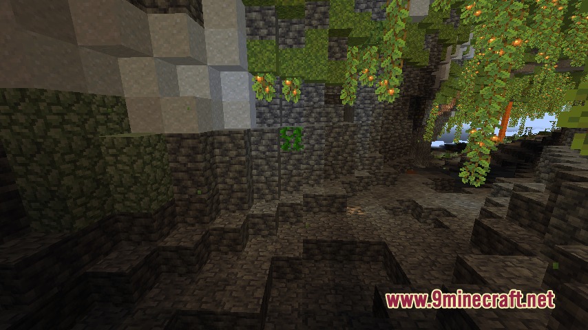Dark cavern showing cobbled stone walls and glowing berries hanging from vines
