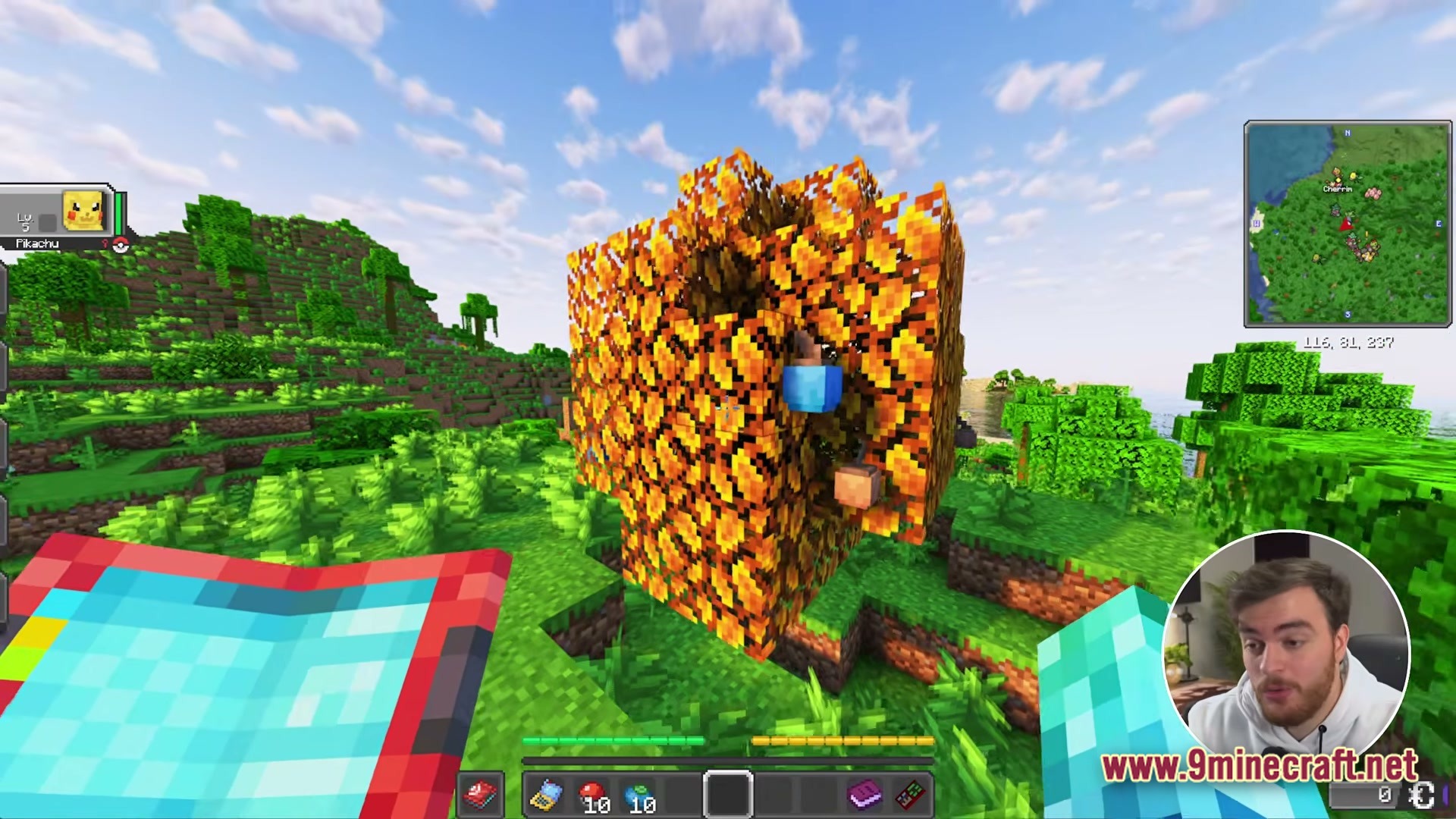 Cobblemon Eternal The Minecraft Pokémon Experience Modpack Screenshot 1 A player explores a vibrant green biome featuring a large tree with orange and yellow leaves