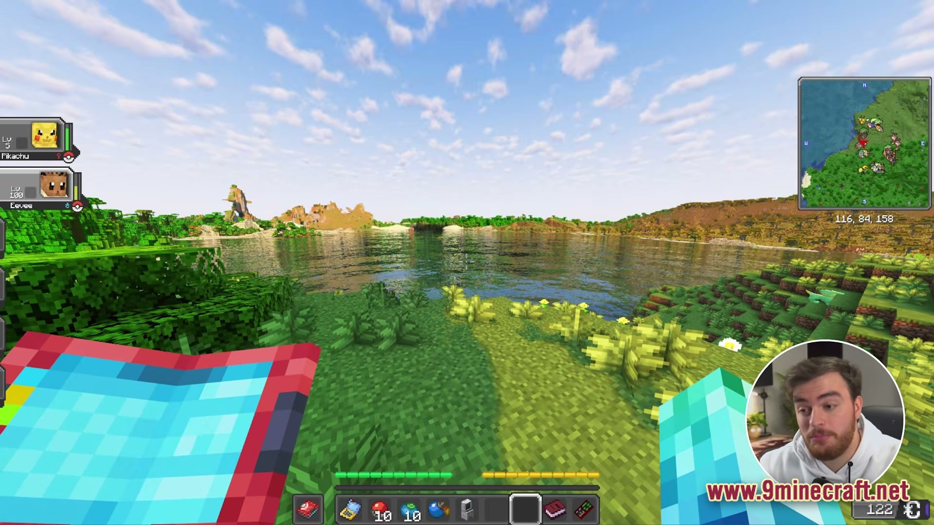 Cobblemon Eternal The Minecraft Pokémon Experience Modpack Screenshot 3 A first-person view of a lakeside biome featuring a Pokémon party HUD and a mini-map