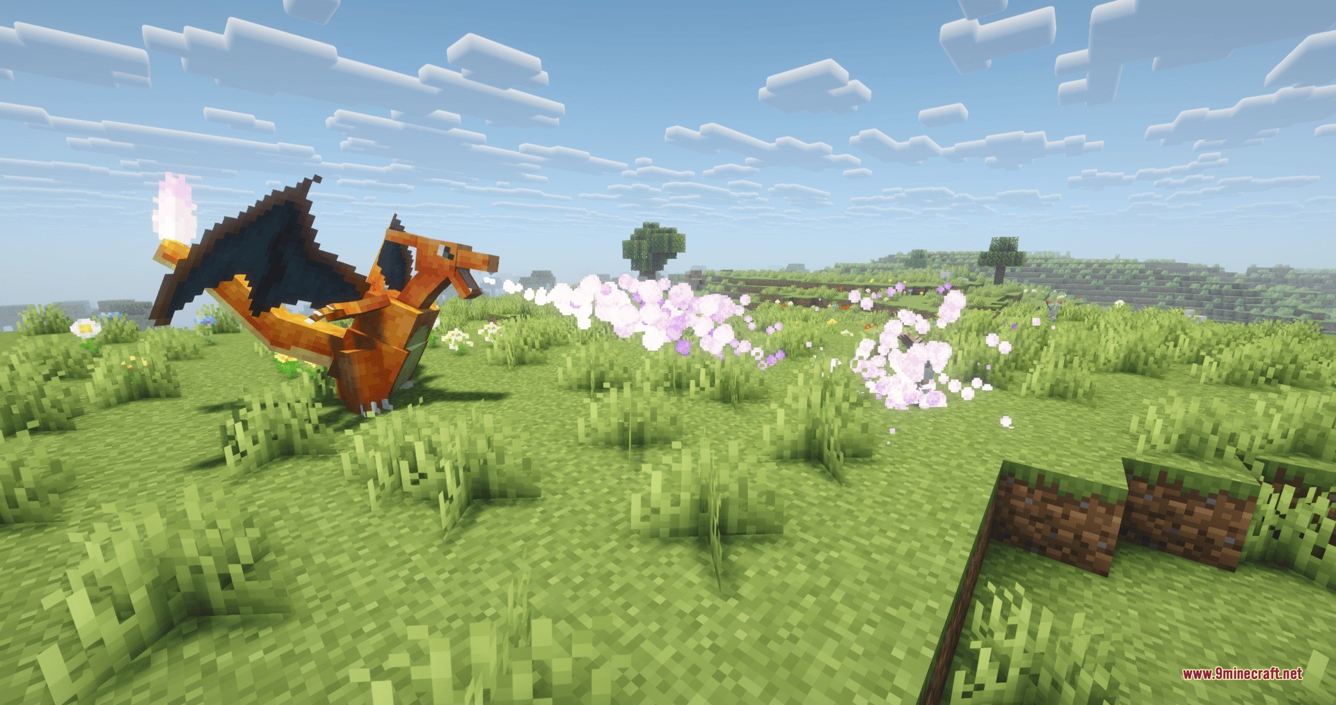 Charizard breathes fire particles during a battle in a grassy meadow