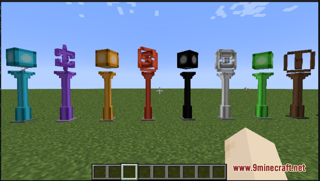 Cobblemon Pokestops Mod Screenshot 1 Eight colorful Pokestop stations from the Cobblemon Pokestops Mod in a field