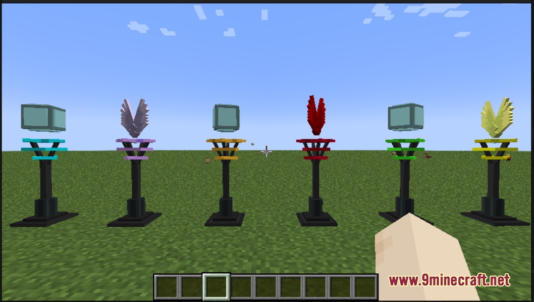 Cobblemon Pokestops Mod Screenshot 2 Six unique winged and cubic Pokestop designs placed on black pedestals outdoors