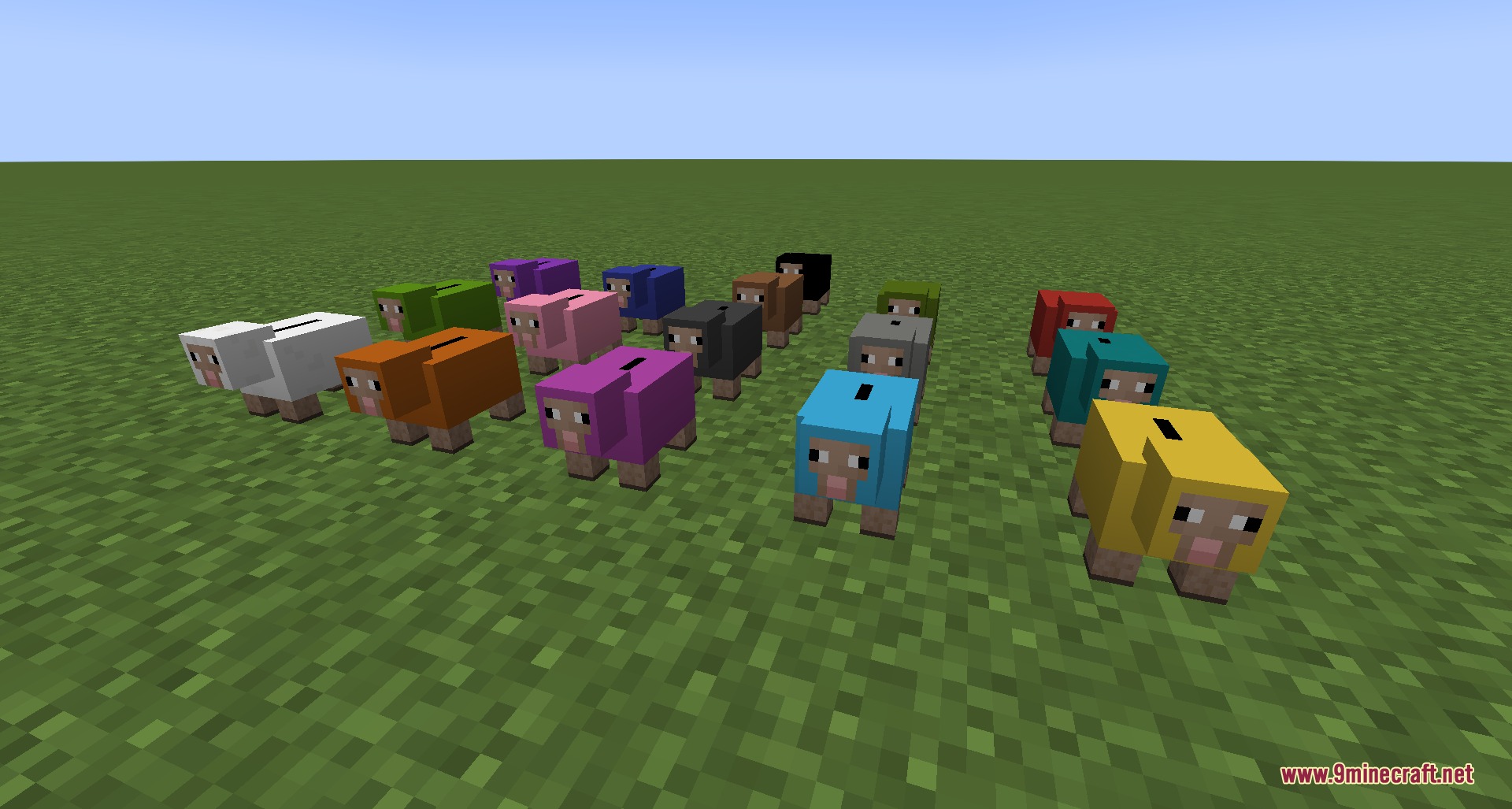 Many colorful sheep shaped coin banks standing on a green grass field