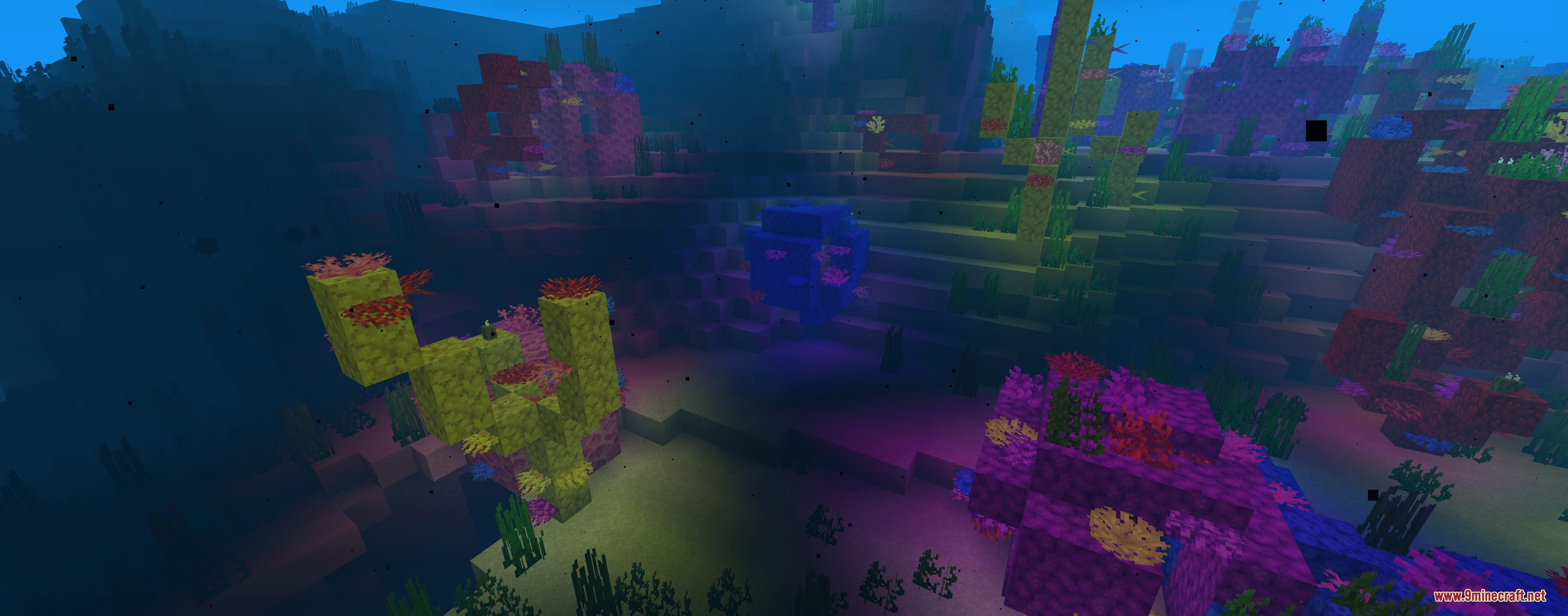 Colorful Lighting Sodium Embeddium Edition Mod Screenshot 7 A glowing blue block illuminates the surrounding colorful underwater coral reef