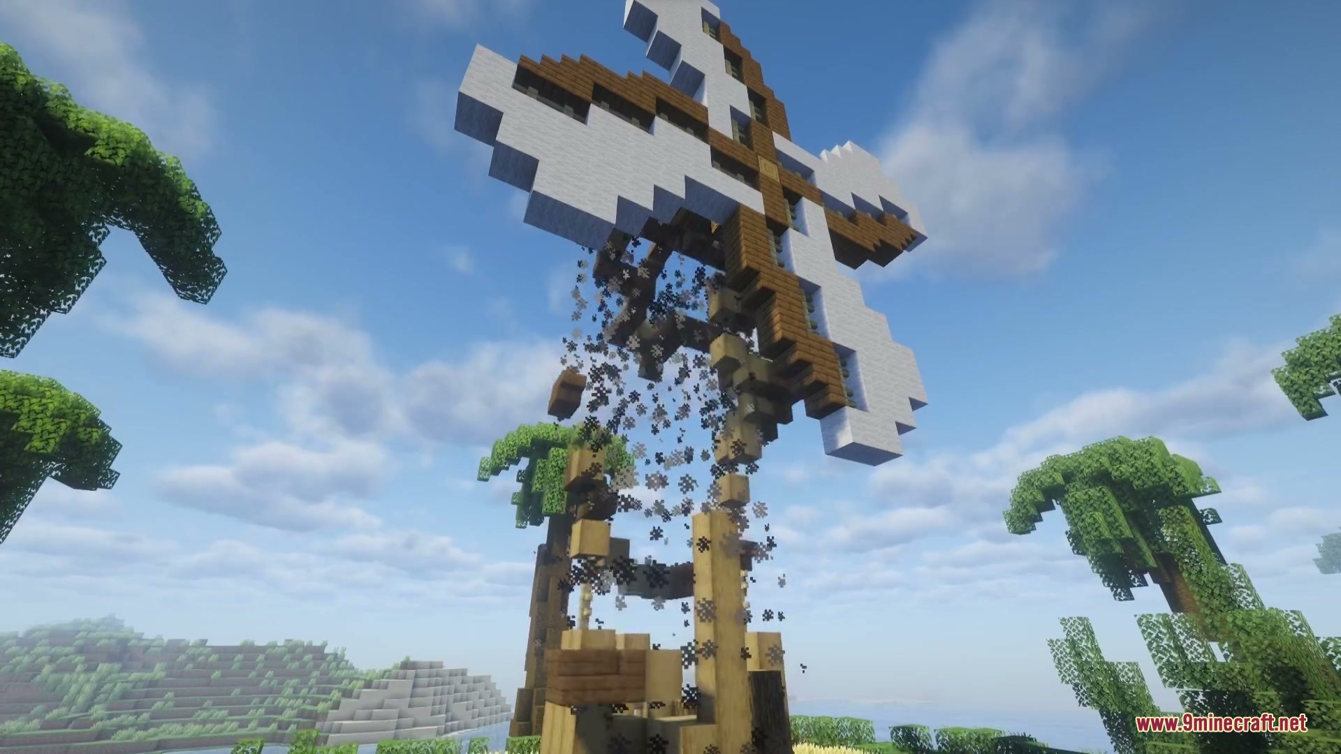 Combustive Ordnance Expansion Mod Screenshot 2 A massive artillery style explosion destroying a wooden windmill with thick smoke clouds