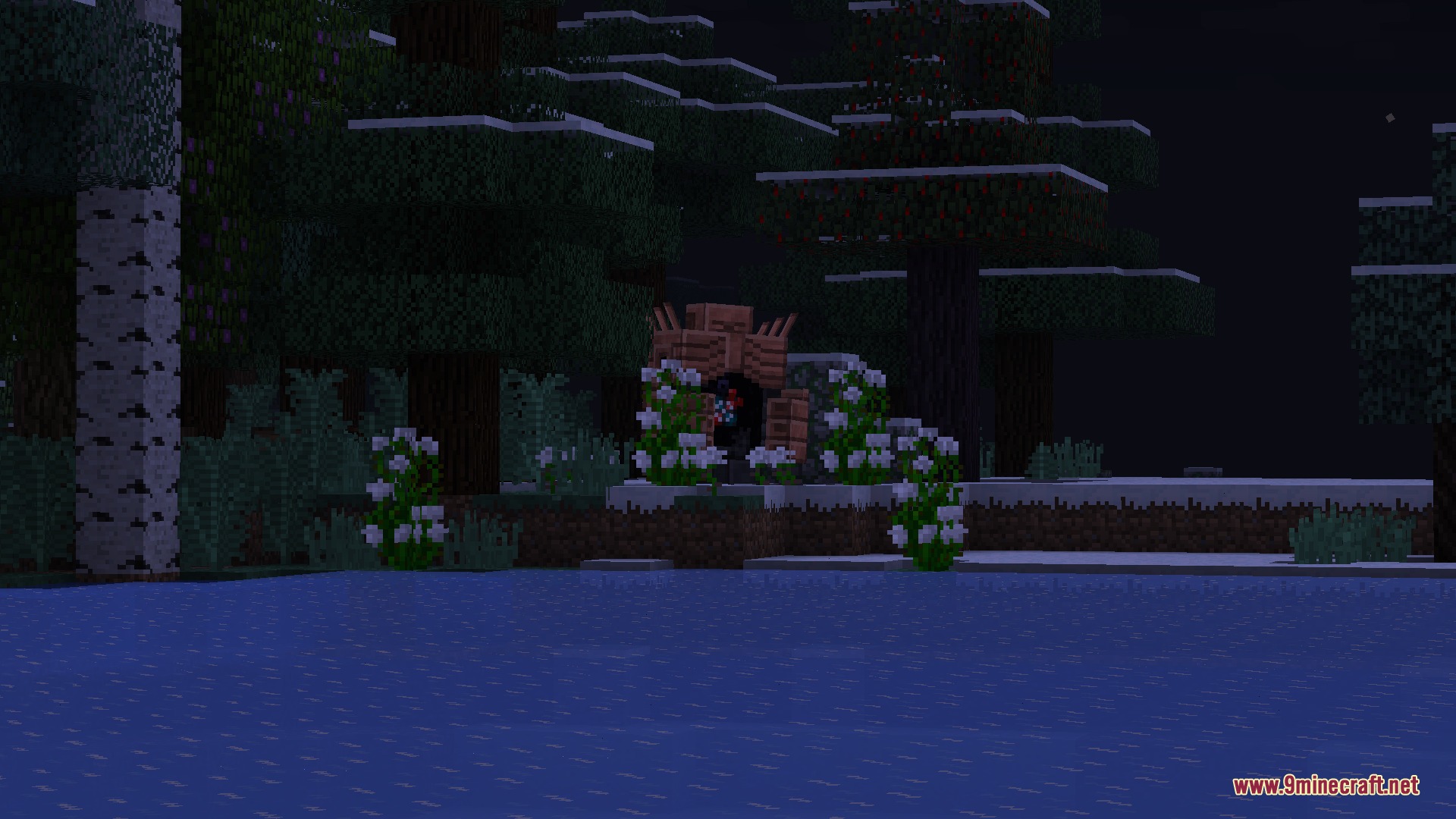 A small wooden shrine with white flowers in a dark forest at night