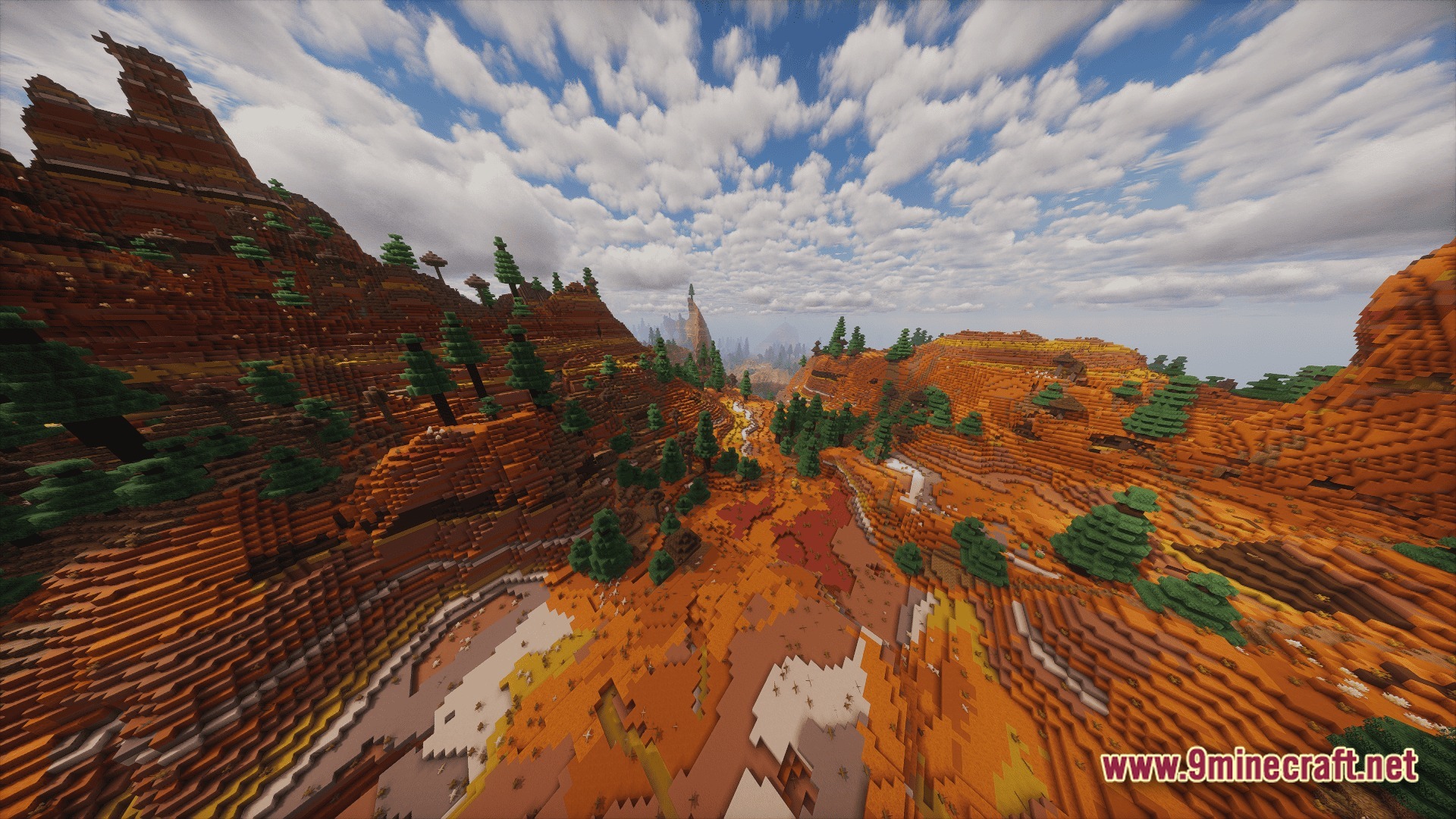 Create Above The Horizon Modpack Screenshot 10 A vast badlands biome featuring layered terracotta cliffs, scattered pine trees, and a cloudy sky