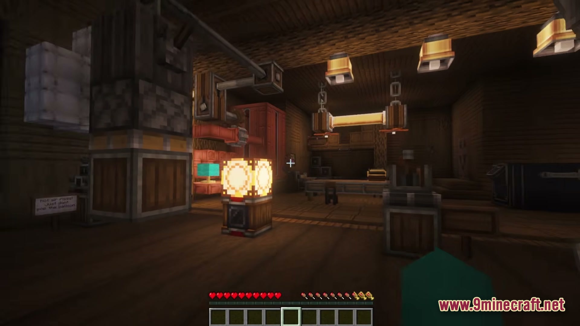 Create Aeronautica Modpack Screenshot 2 A dimly lit wooden interior featuring various mechanical components and industrial lighting from the Create mod