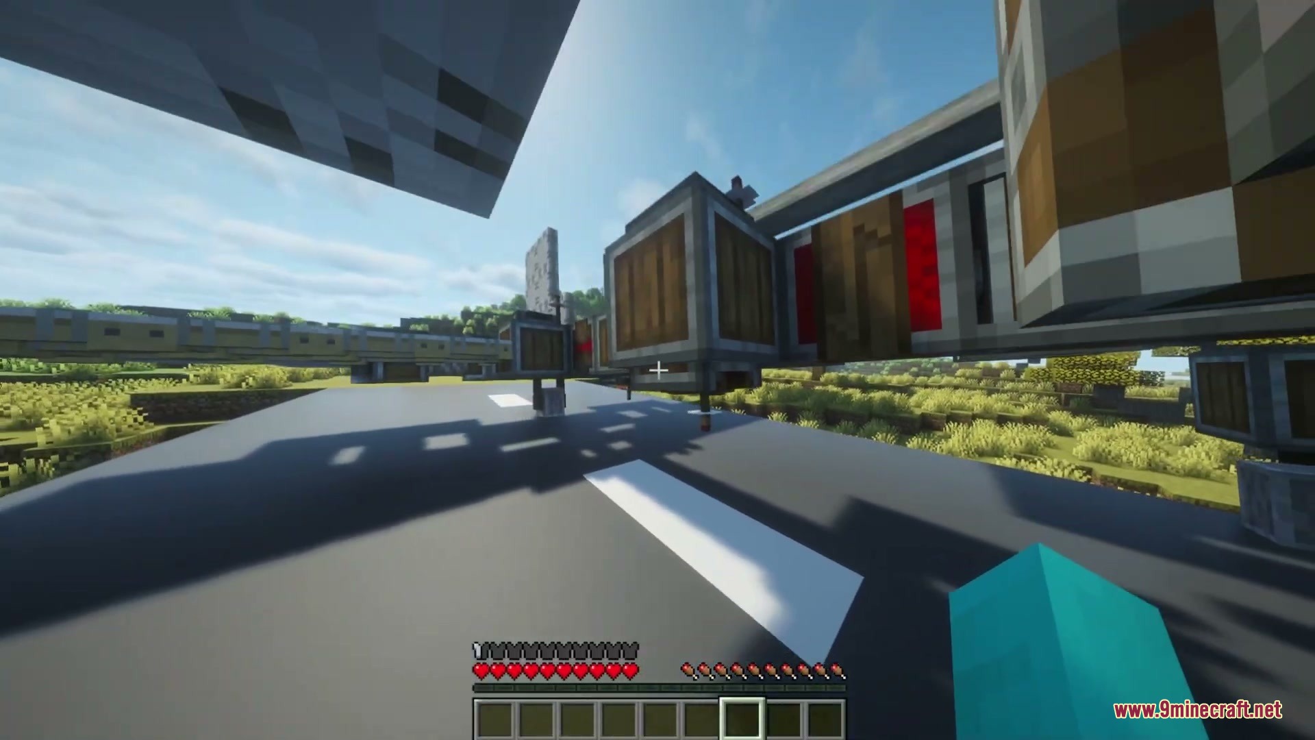 Create Aeroworks Mod Screenshot 7 A custom flying machine built with mechanical blocks on a flat gray runway