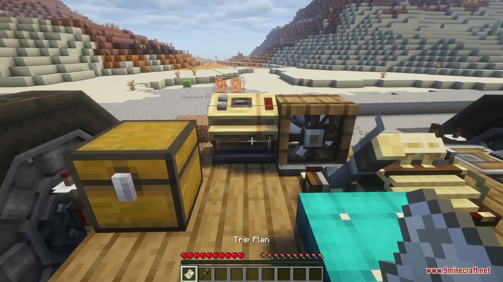 A player holds a trip plan item to set an automated route