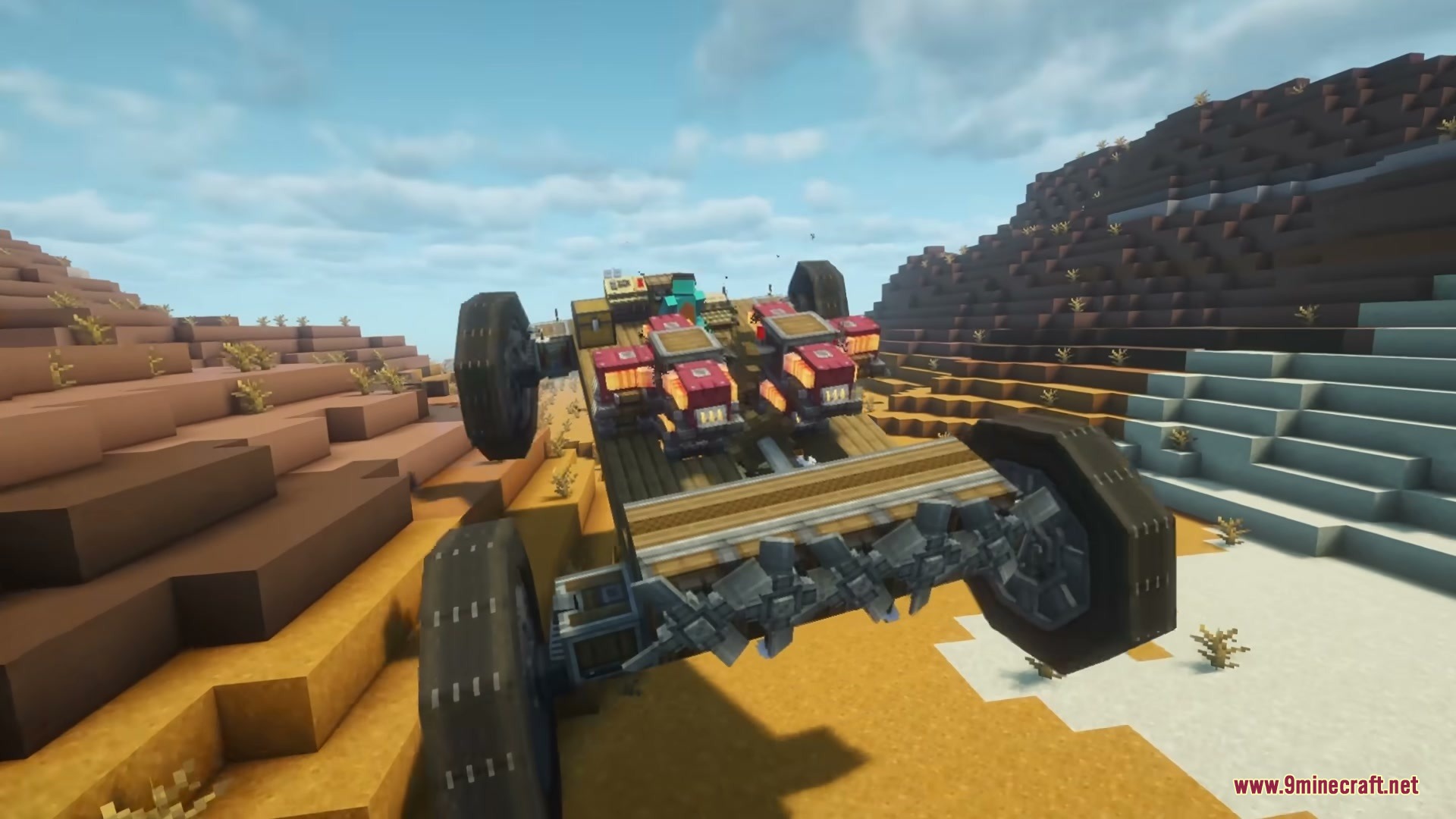 Mechanical contraption with large wheels driving through a vast sandy desert landscape