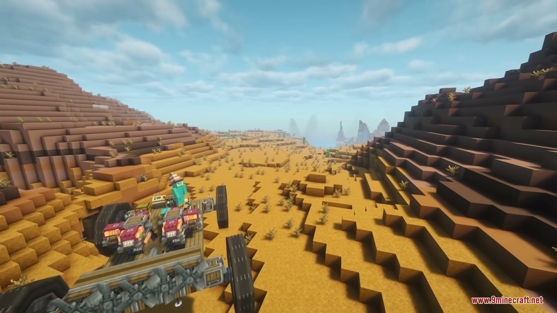 A player wearing a traffic cone hat stands on a custom desert vehicle