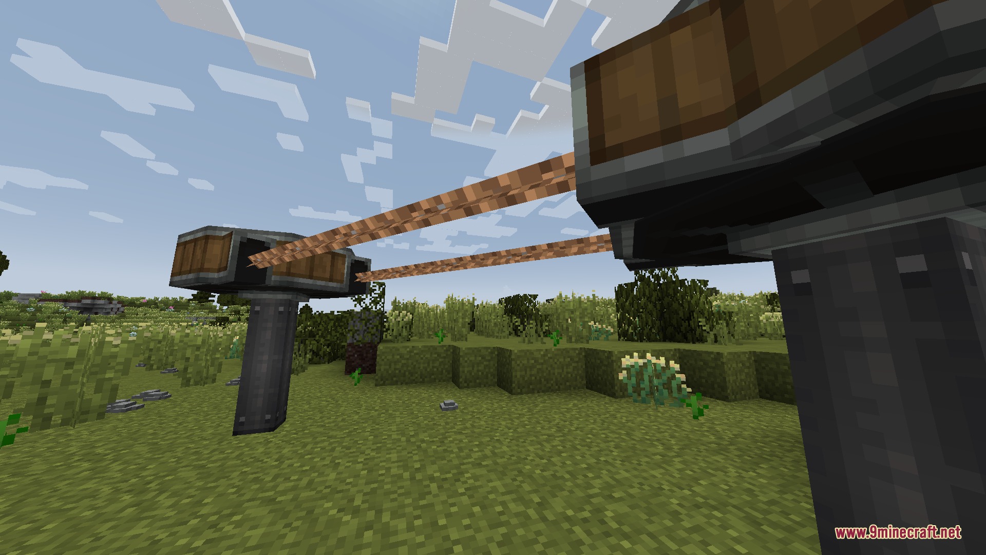 Create Chain Conveyors Compat Mod Screenshot 5 Two metal pillars connected by ropes using the Create Chain Conveyors Compat mod