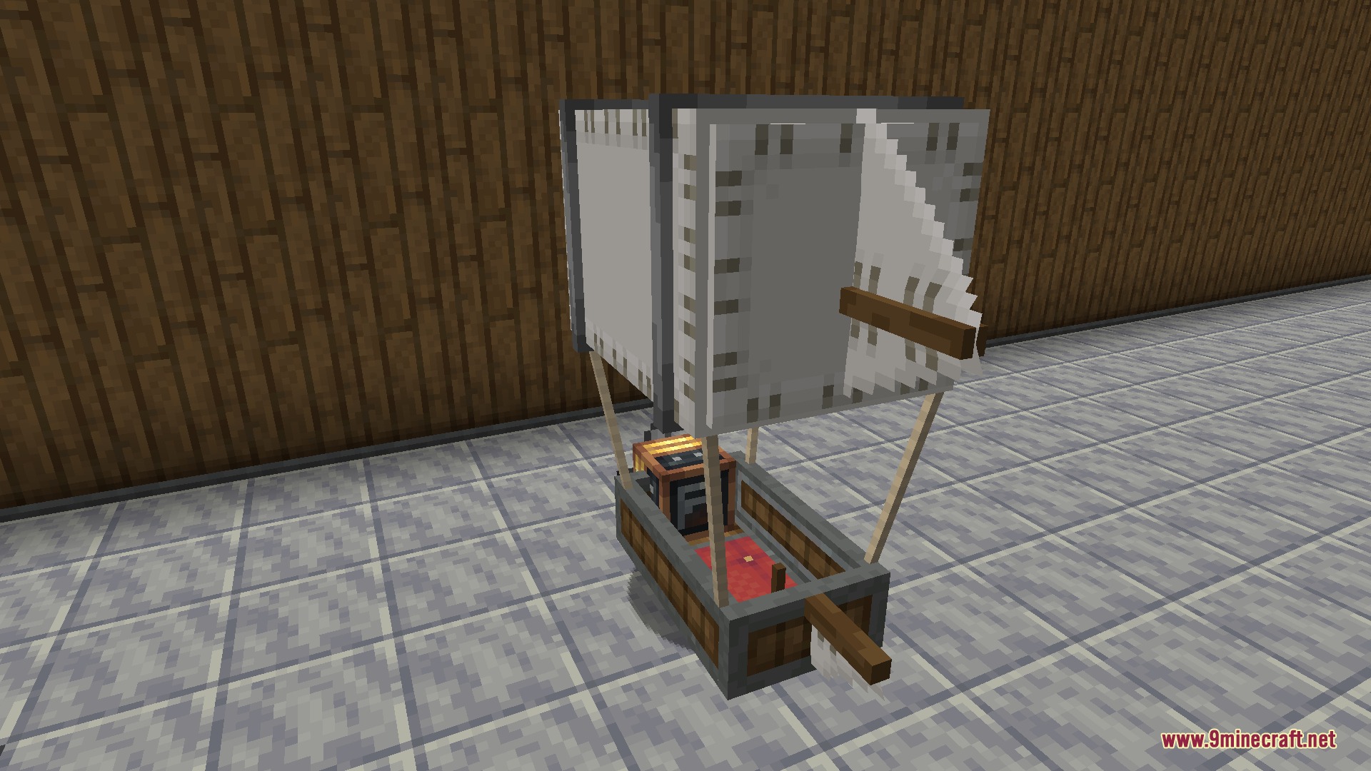A small airship with white sails and a wooden gondola in Minecraft