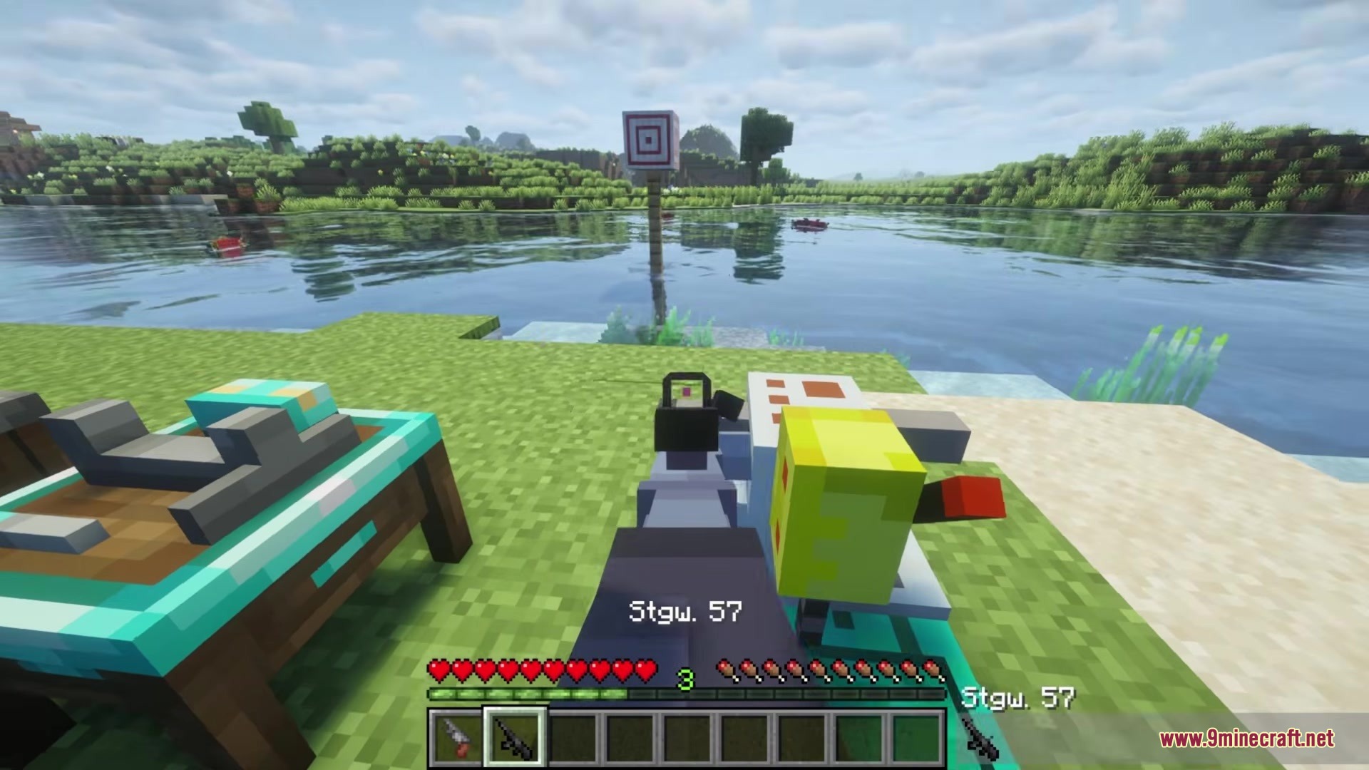 Player aiming a Stgw 57 rifle at a target block across water