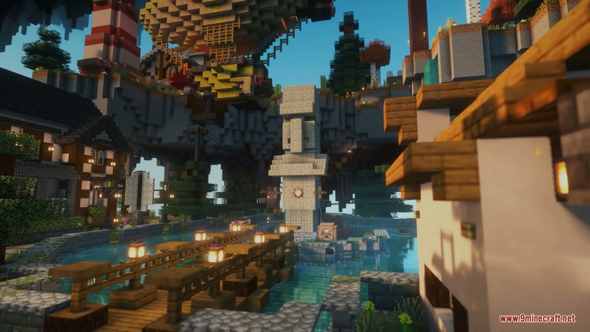 A floating village in the sky with a bridge and a stone statue