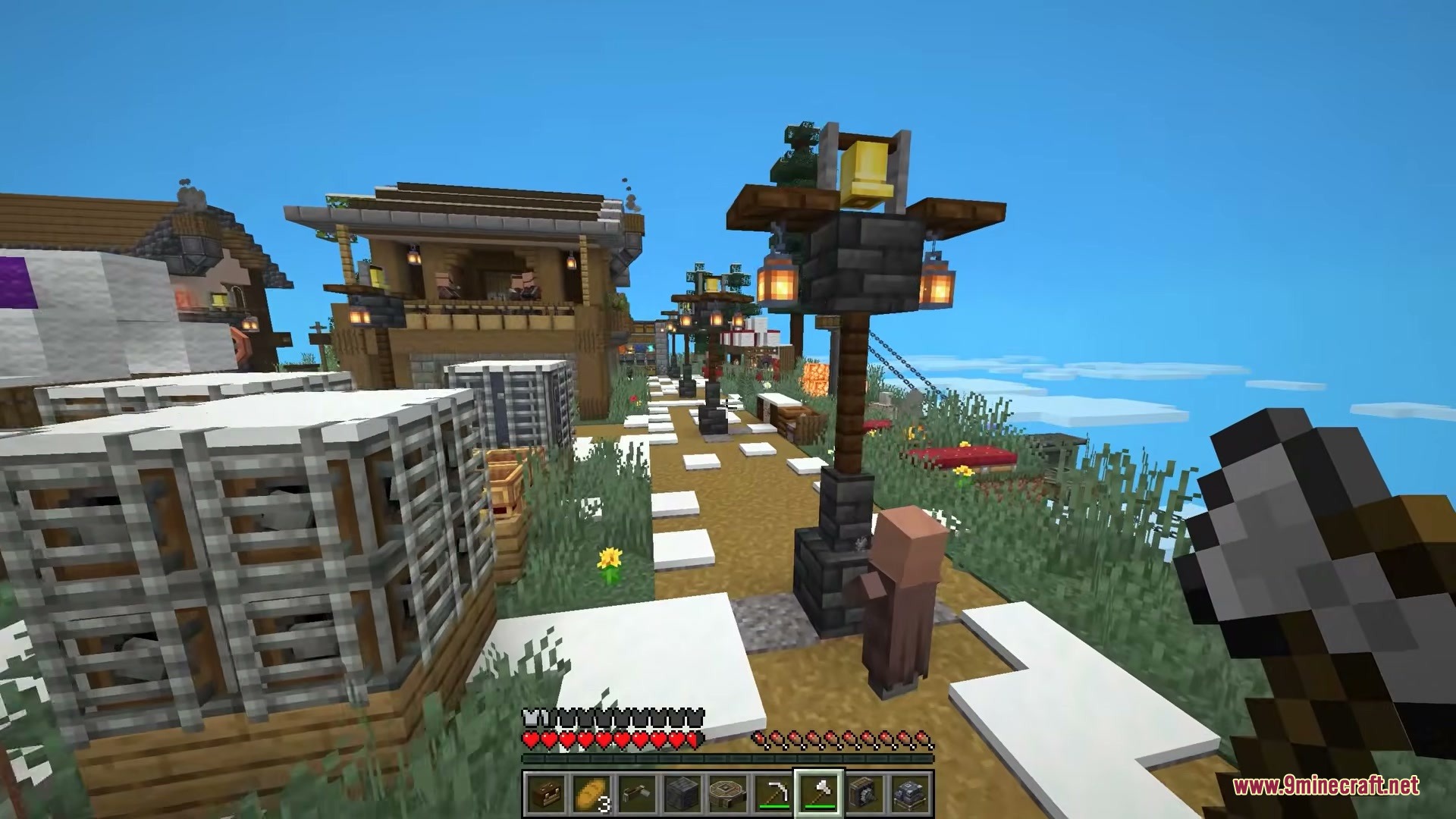 A villager stands near a bell lamppost in a floating sky village