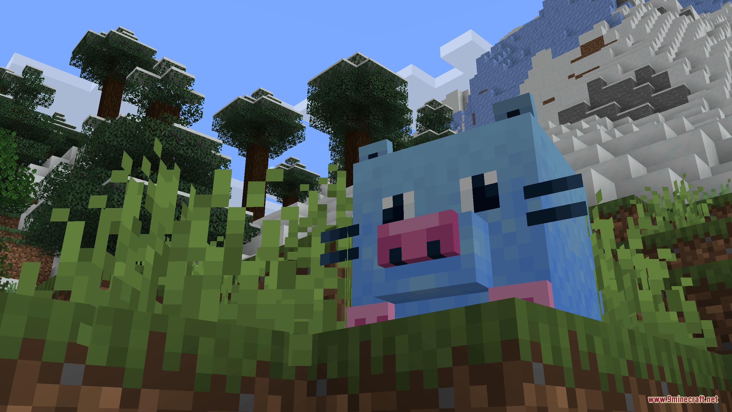 A goofy blue rat mob standing in a grassy forest biome