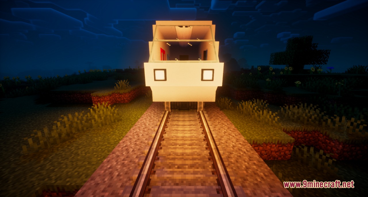 Create Train Lights Mod Screenshot 2 A train with bright white headlights and interior lighting on tracks at night
