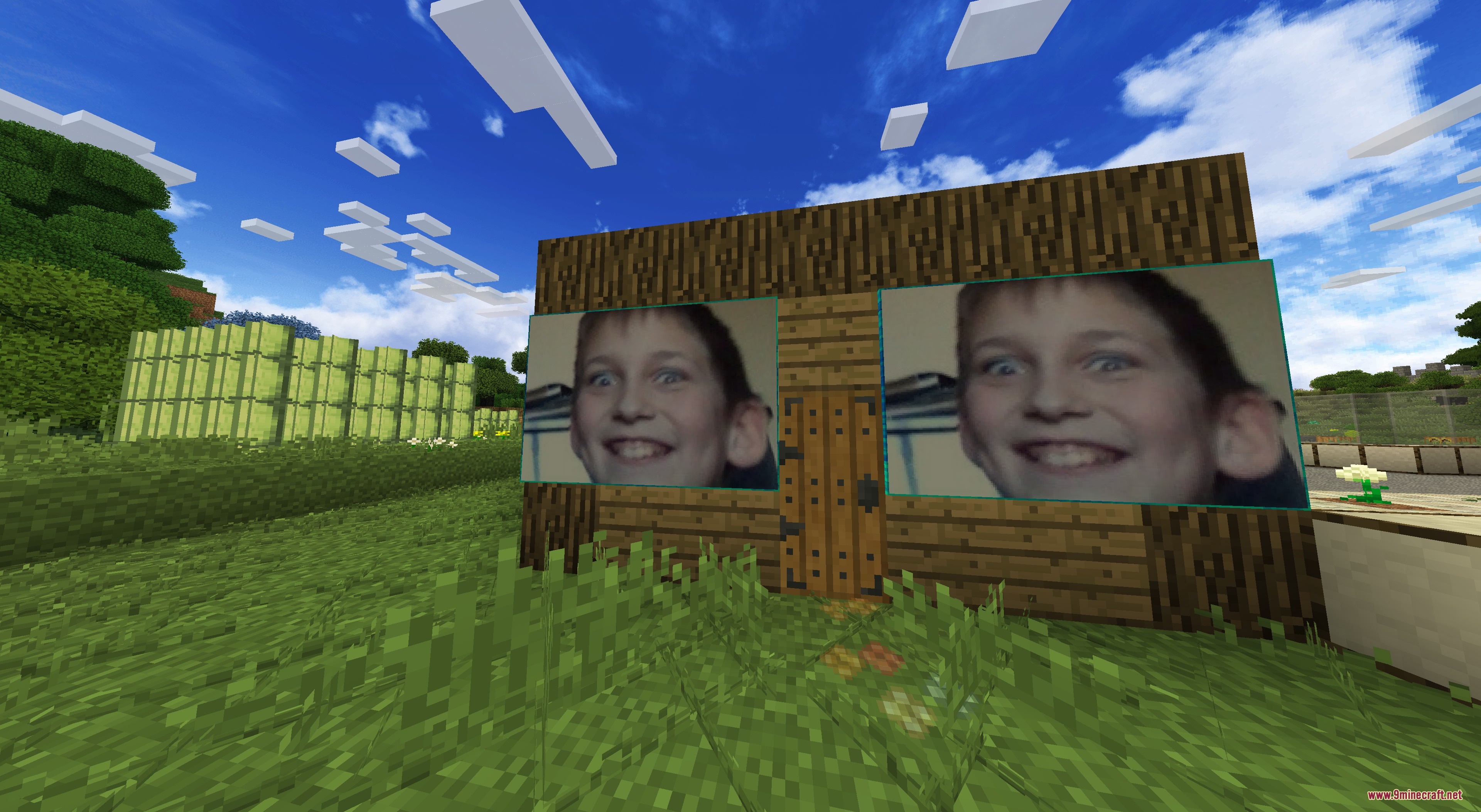 DO NOT DISABLE Resource Pack Screenshot 7 A wooden Minecraft house featuring two large custom portraits of a smiling boy