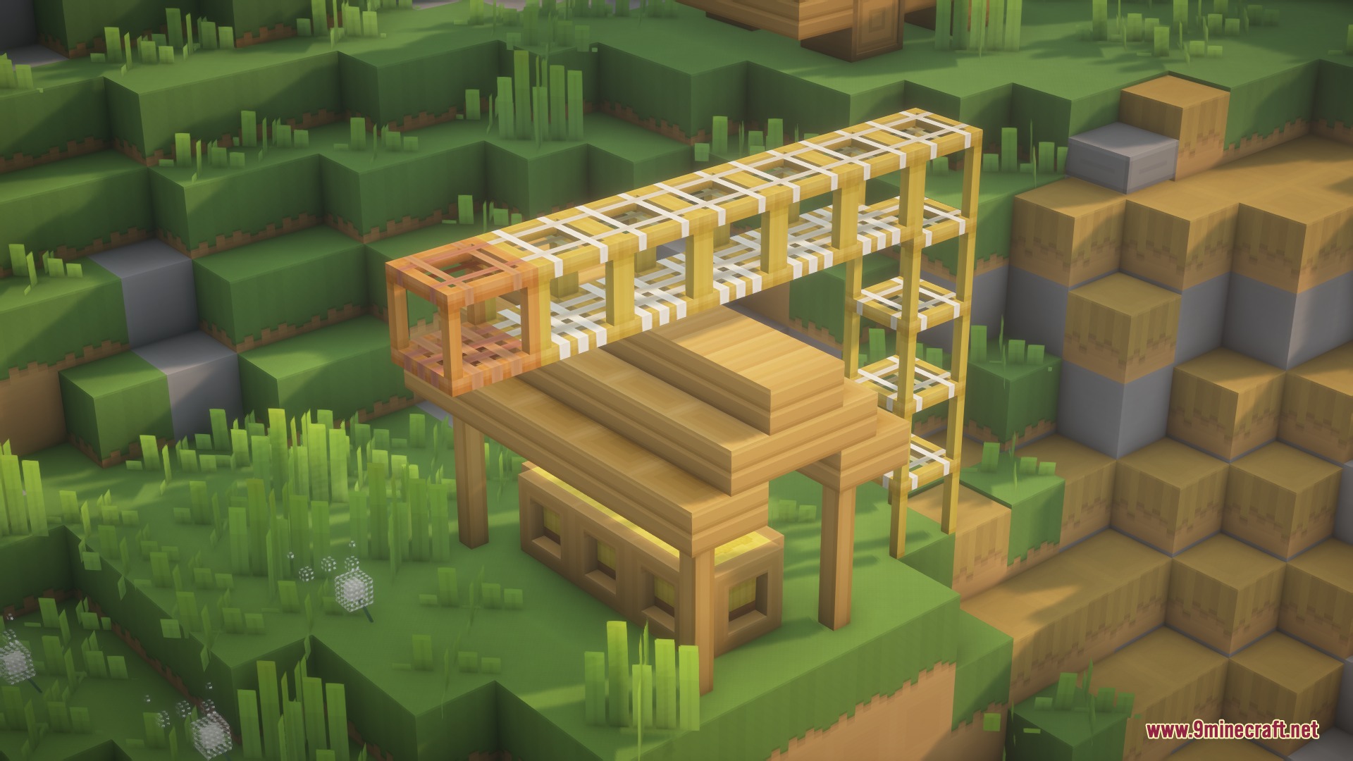 Clean wooden scaffolding and structures built on a vibrant green grassy hill