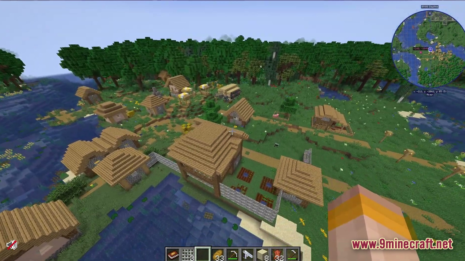 Deadbolt Tactical Survival Modpack Screenshot 1 An aerial view of a Minecraft village situated between a forest and a river biome