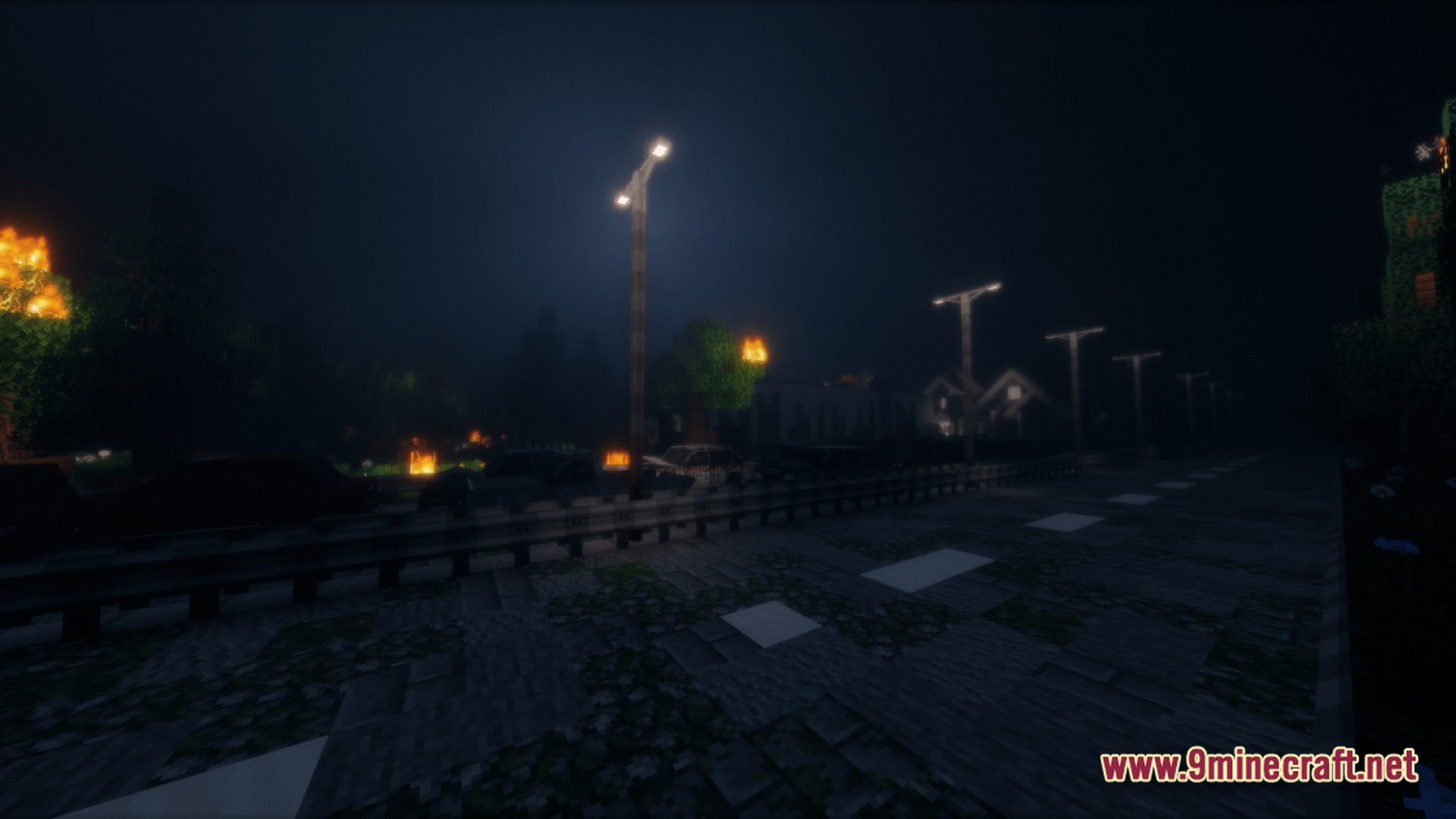 Deadbolt Tactical Survival Modpack Screenshot 7 A dark asphalt road lined with streetlights and burning trees in a post-apocalyptic urban environment