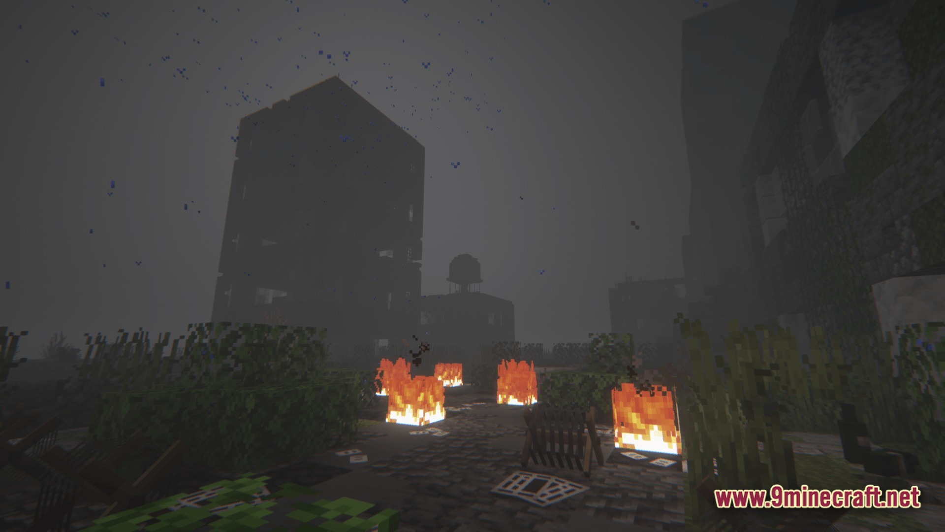 Deadbolt Tactical Survival Modpack Screenshot 9 A desolate urban landscape featuring ruined buildings, scattered fires, and overgrown vegetation under a foggy sky