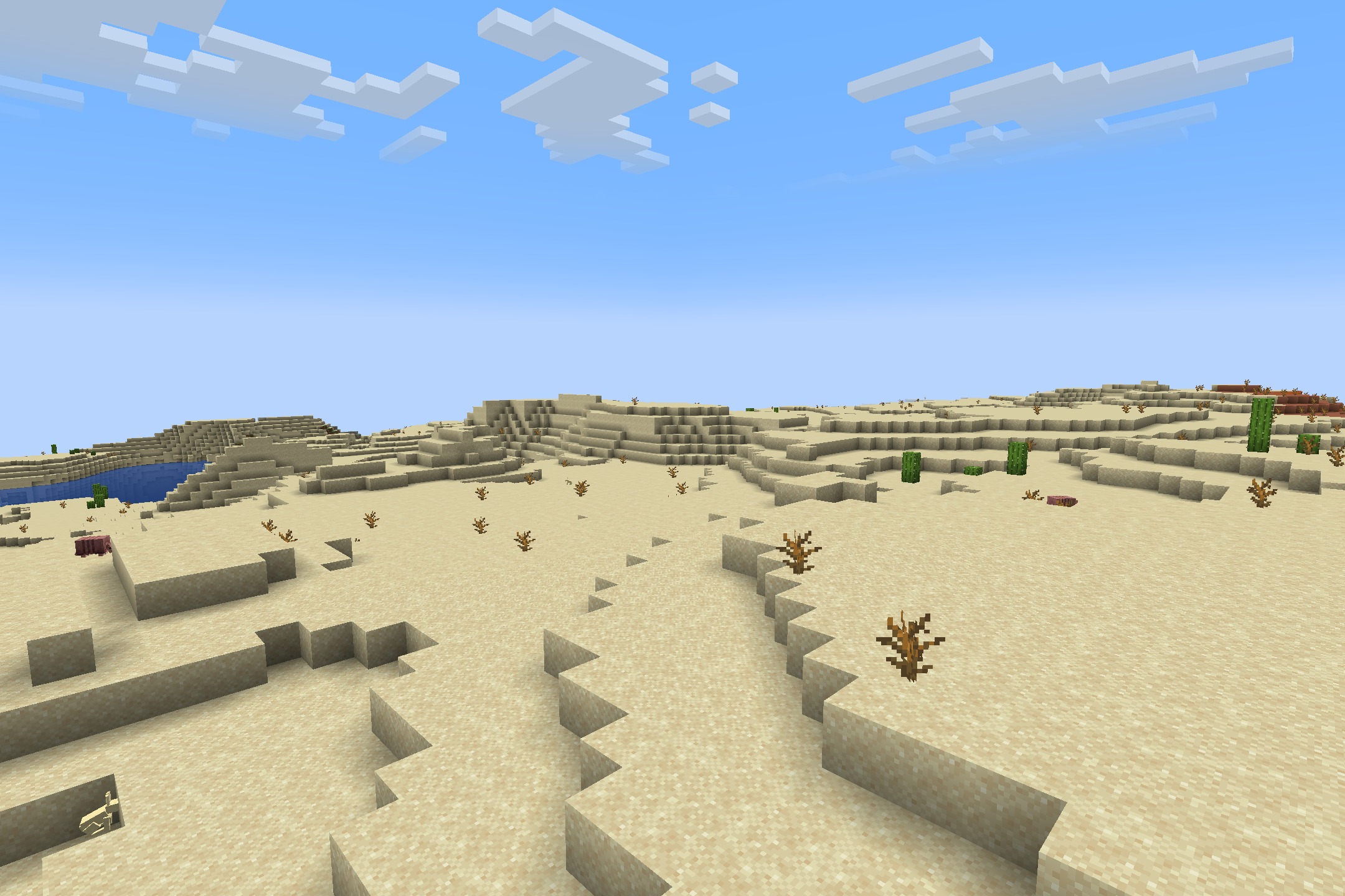 Default HD 512x Resource Pack Screenshot 9 Detailed sand blocks and dead bushes in a vast desert under blue sky