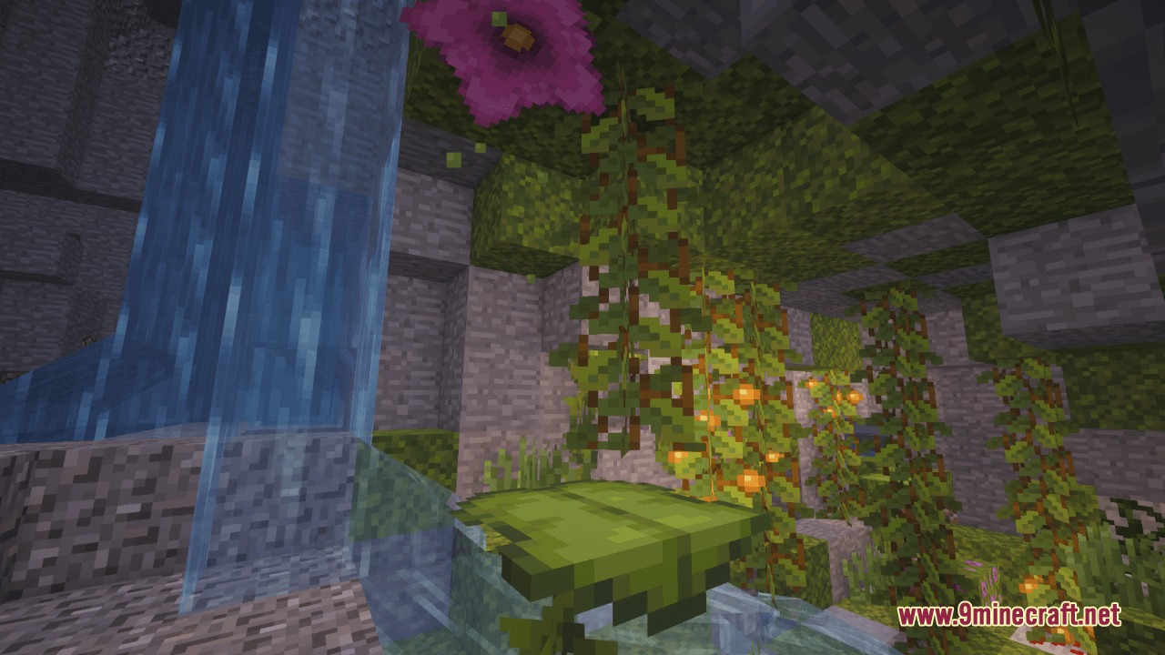 A lush cave with a waterfall glow berries and a big dripleaf