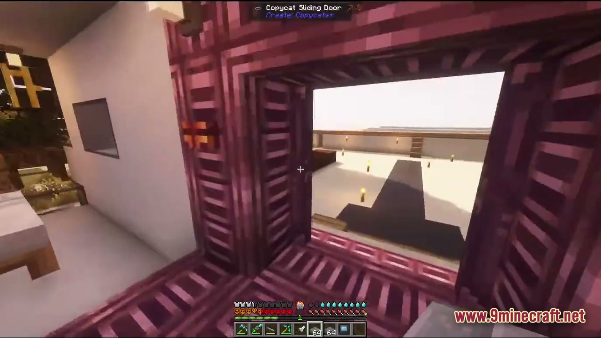 Desolate Planet A Crash Landing Remake Modpack Screenshot 4 A player looks through an open Copycat Sliding Door toward a brightly lit outdoor courtyard
