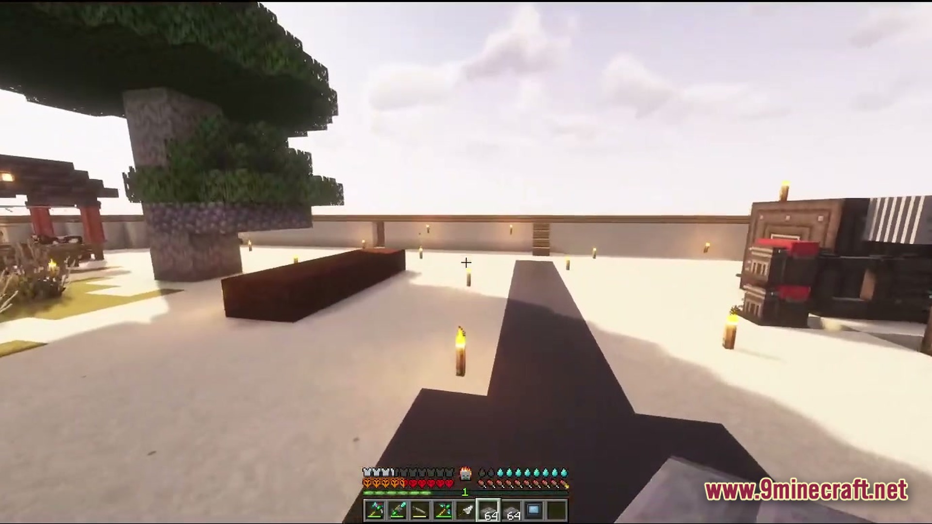 Desolate Planet A Crash Landing Remake Modpack Screenshot 5 A player stands in a desert base with machines, a large tree, and a perimeter wall